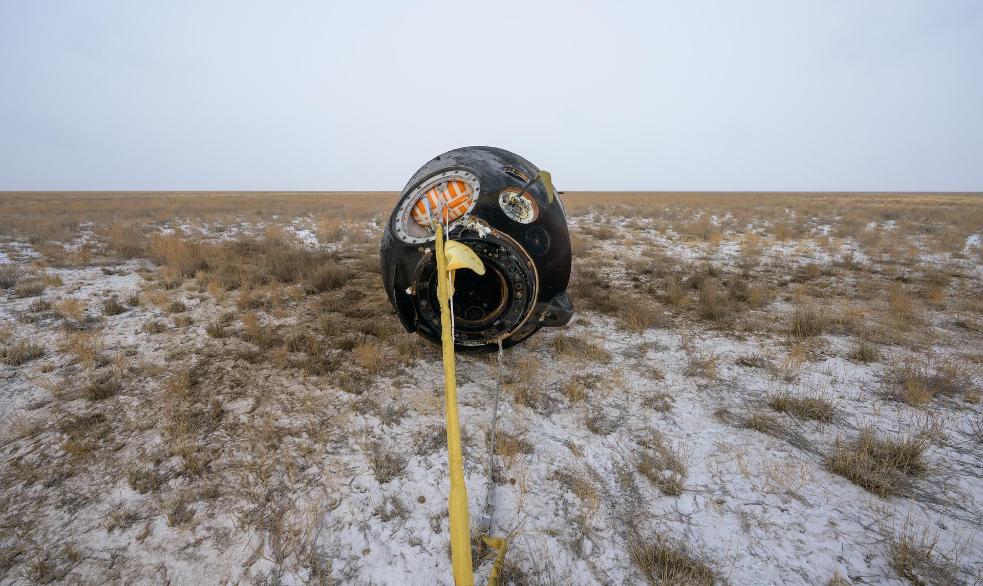 The Soyuz MS-27 spacecraft is seen after it landed in a remote area near the town of Zhezkazgan, Kazakhstan with Expedition 73 NASA astronaut Jonny Kim, and Roscosmos cosmonauts Sergey Ryzhikov, and Alexey Zubritsky aboard, Tuesday, Dec. 9, 2025. The trio are returning to Earth after logging 245 days in space as members of Expeditions 72 and 73 aboard the International Space Station. Photo Credit: (NASA/Bill Ingalls)
