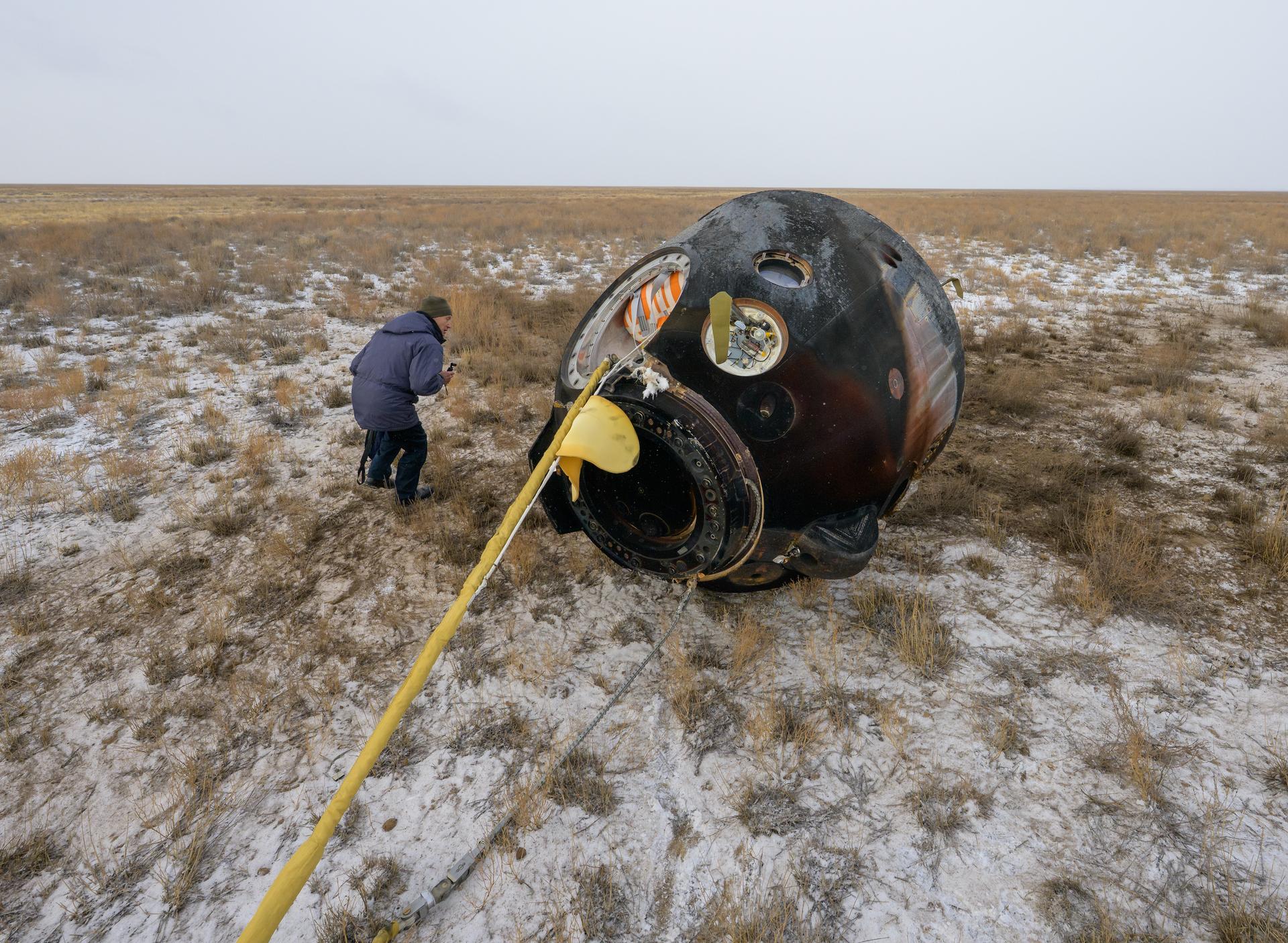 The Soyuz MS-27 spacecraft is seen after it landed in a remote area near the town of Zhezkazgan, Kazakhstan with Expedition 73 NASA astronaut Jonny Kim, and Roscosmos cosmonauts Sergey Ryzhikov, and Alexey Zubritsky aboard, Tuesday, Dec. 9, 2025. The trio are returning to Earth after logging 245 days in space as members of Expeditions 72 and 73 aboard the International Space Station. Photo Credit: (NASA/Bill Ingalls)