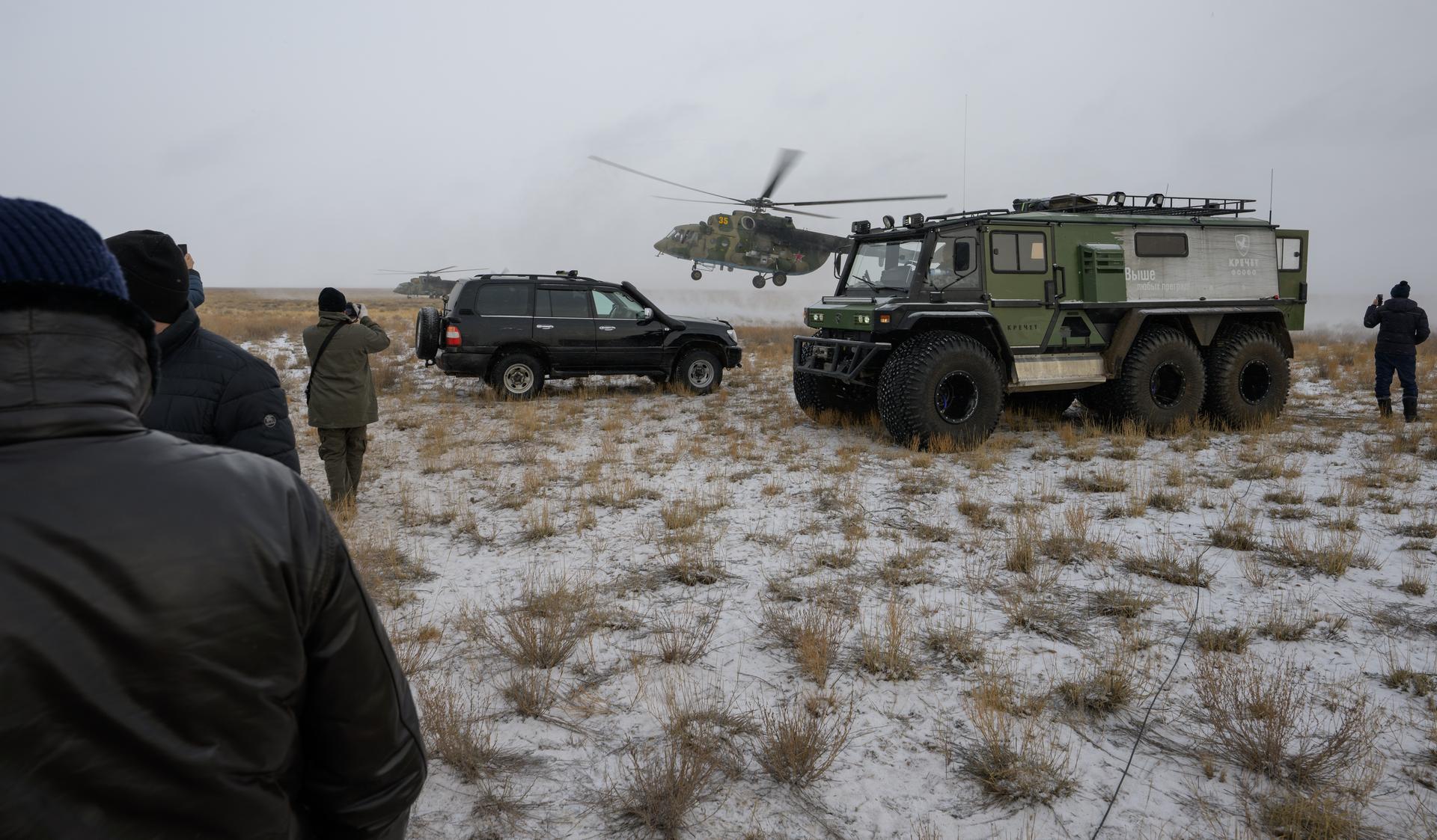 Russian Search and Rescue teams arrive at the Soyuz MS-27 spacecraft landing site shortly after it landed in a remote area near the town of Zhezkazgan, Kazakhstan with Expedition 73 NASA astronaut Jonny Kim, and Roscosmos cosmonauts Sergey Ryzhikov, and Alexey Zubritsky aboard, Tuesday, Dec. 9, 2025. The trio returned to Earth after logging 245 days in space as a members of Expeditions 72 and 73 aboard the International Space Station. Photo Credit: (NASA/Bill Ingalls)