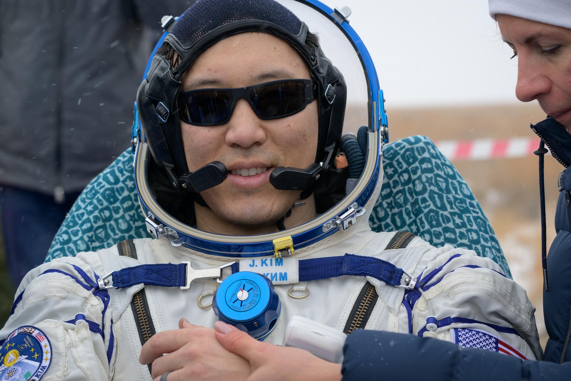 NASA astronaut Jonny Kim is seen outside the Soyuz MS-27 spacecraft after he landed with Roscosmos cosmonauts Sergey Ryzhikov, and Alexey Zubritsky in a remote area near the town of Zhezkazgan, Kazakhstan on Tuesday, Dec. 9, 2025. The trio returned to Earth after logging 245 days in space as a members of Expeditions 72 and 73 aboard the International Space Station. Photo Credit: (NASA/Bill Ingalls)