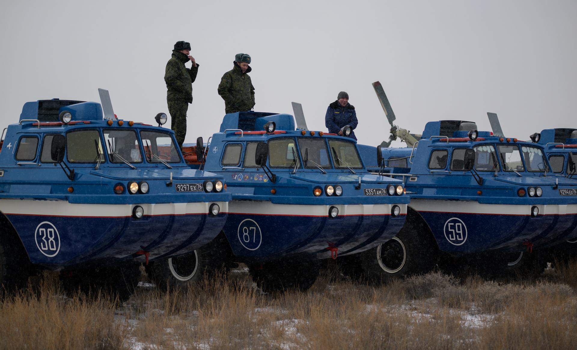 Russian all terrain vehicle (ATV) support personnel are seen near the Soyuz MS-27 spacecraft shortly after it landed in a remote area near the town of Zhezkazgan, Kazakhstan with Expedition 73 NASA astronaut Jonny Kim, and Roscosmos cosmonauts Sergey Ryzhikov, and Alexey Zubritsky aboard, Tuesday, Dec. 9, 2025. The trio returned to Earth after logging 245 days in space as a members of Expeditions 72 and 73 aboard the International Space Station. Photo Credit: (NASA/Bill Ingalls)