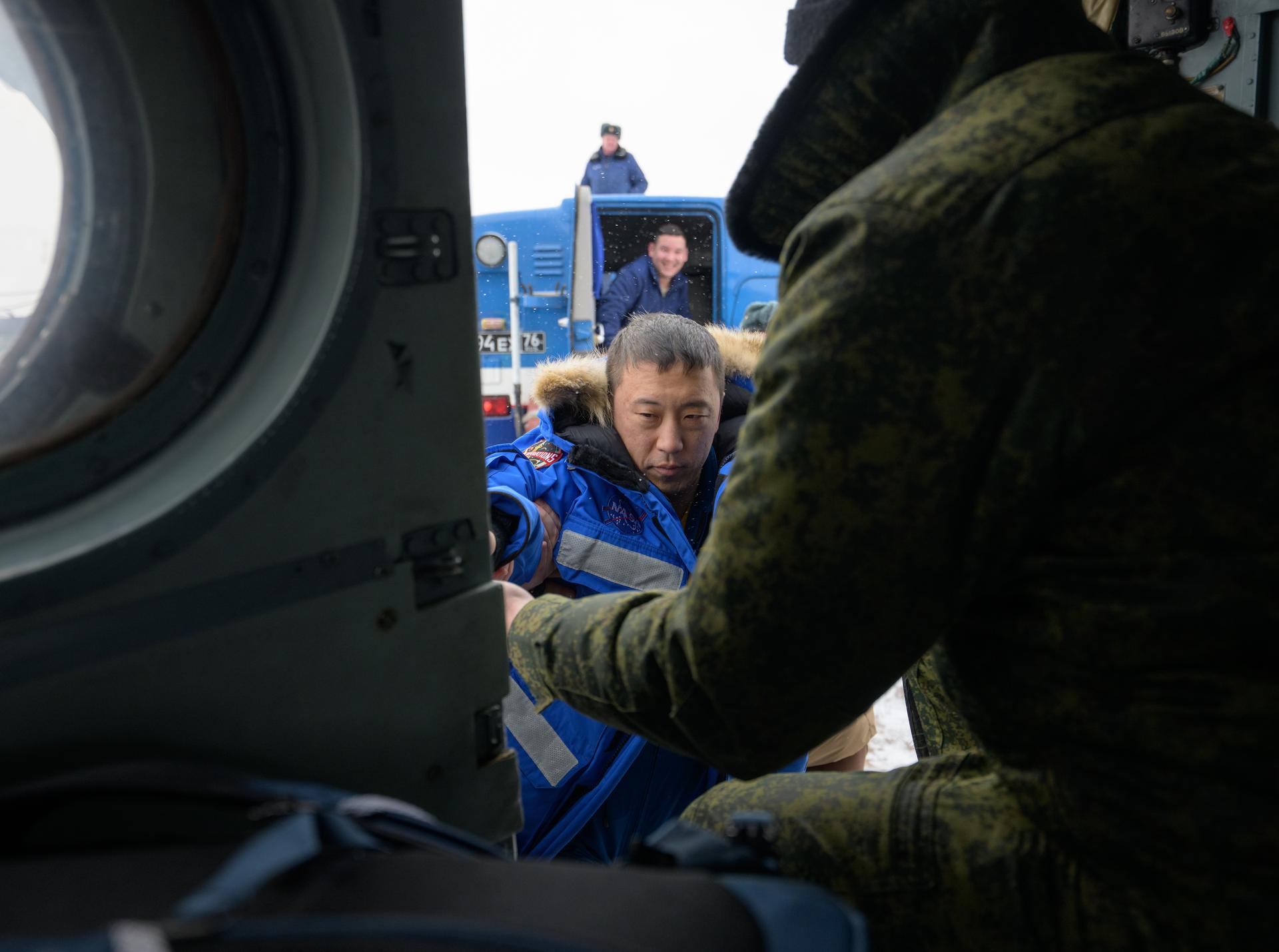 NASA astronaut Jonny Kim boards a Russian MI-8 helicopter to take him to Karaganda after he, Roscosmos cosmonauts Sergey Ryzhikov, and Alexey Zubritsky, landed in their Soyuz MS-27 spacecraft near the town of Zhezkazgan, Kazakhstan on Tuesday, Dec. 9, 2025. The trio returned to Earth after logging 245 days in space as a members of Expeditions 72 and 73 aboard the International Space Station. Photo Credit: (NASA/Bill Ingalls)