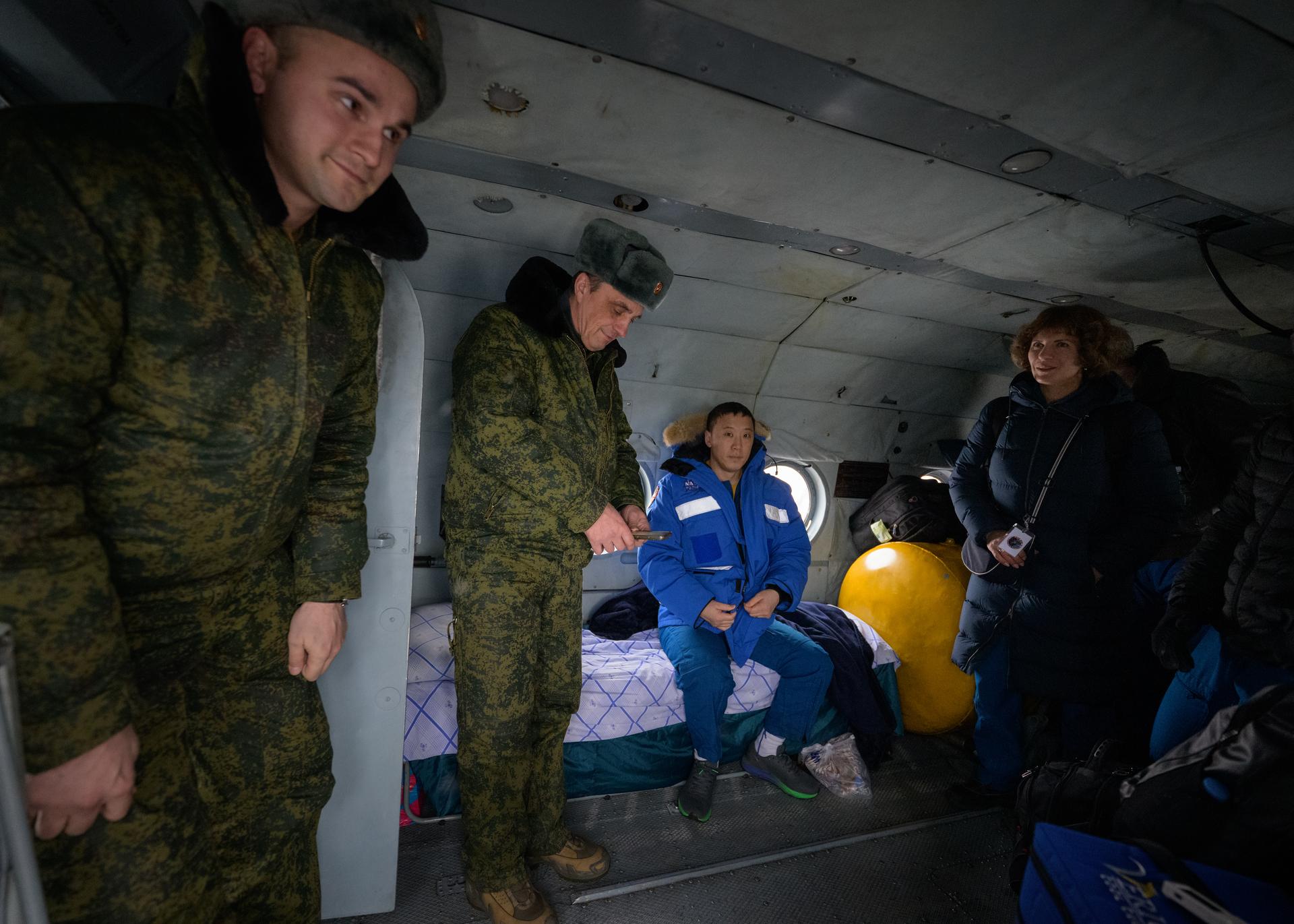 NASA astronaut Jonny Kim, seated, arrives at the Karaganda Airport in Kazakhstan after he, Roscosmos cosmonauts Sergey Ryzhikov, and Alexey Zubritsky, landed in their Soyuz MS-27 spacecraft in a remote area near the town of Zhezkazgan, Kazakhstan on Tuesday, Dec. 9, 2025. The trio returned to Earth after logging 245 days in space as a members of Expeditions 72 and 73 aboard the International Space Station. Photo Credit: (NASA/Bill Ingalls)