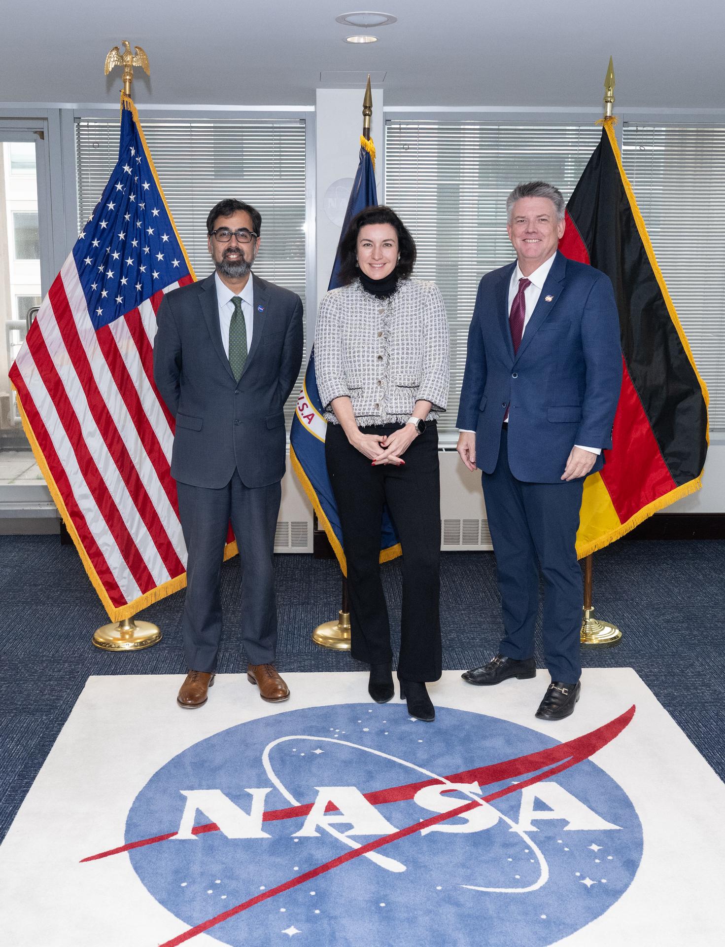 NASA Associate Administrator Amit Kshatriya, left, German Minister for Research, Technology, and Space Dorothee Bär, center, and NASA Chief off Staff Brian Hughes, pose for a picture, Tuesday, Dec. 9, 2025, before a meeting at the Mary W. Jackson NASA Headquarters building in Washington. Photo Credit: (NASA/Joel Kowsky)