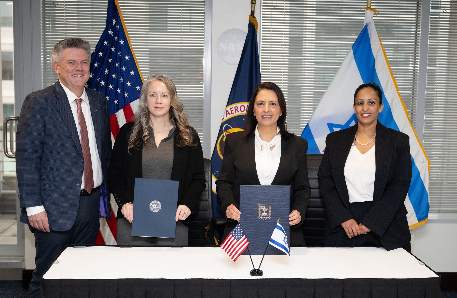 Brian Hughes, NASA Chief of Staff, left, Meredith McKay, acting associate administrator for NASA’s Office of International and Interagency Relations, second from left, Israel’s Minister for Innovation, Science, and Technology Gila Gamliel, and Shani Edri, director of International Relations in Israel’s Ministry of Innovation, Science, and Technology pose for a picture after the signing the US-Israel Space Cooperation Framework Agreement Extension, Wednesday, Dec. 10, 2025, at the Mary W. Jackson NASA Headquarters building in Washington. Photo Credit: (NASA/Joel Kowsky)