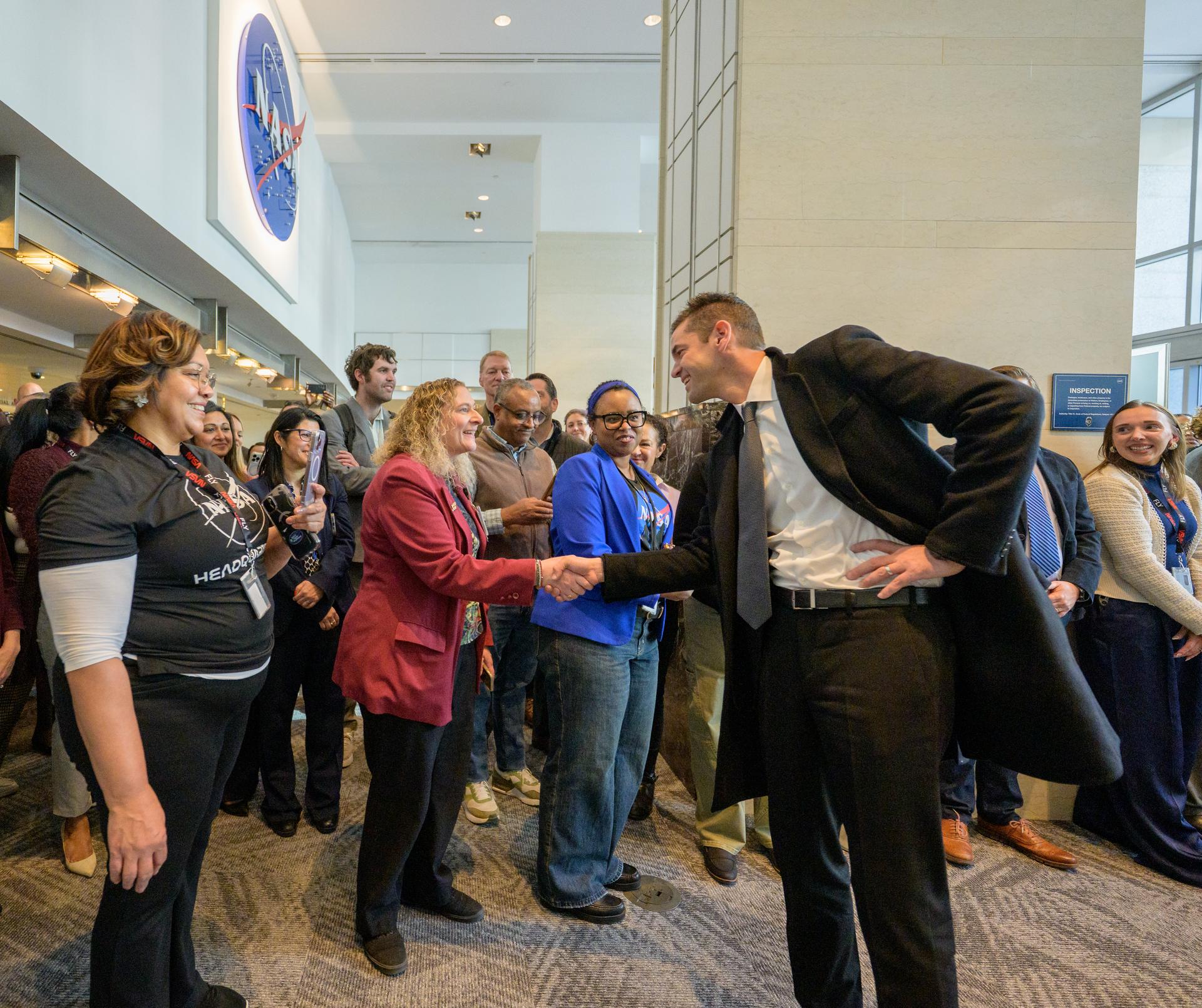 NASA Administrator Jared Isaacman is welcomed by NASA employees as he enters the Mary W. Jackson NASA Headquarters Building in Washington, Thursday, Dec. 18, 2025. Photo Credit: (NASA/Bill Ingalls)