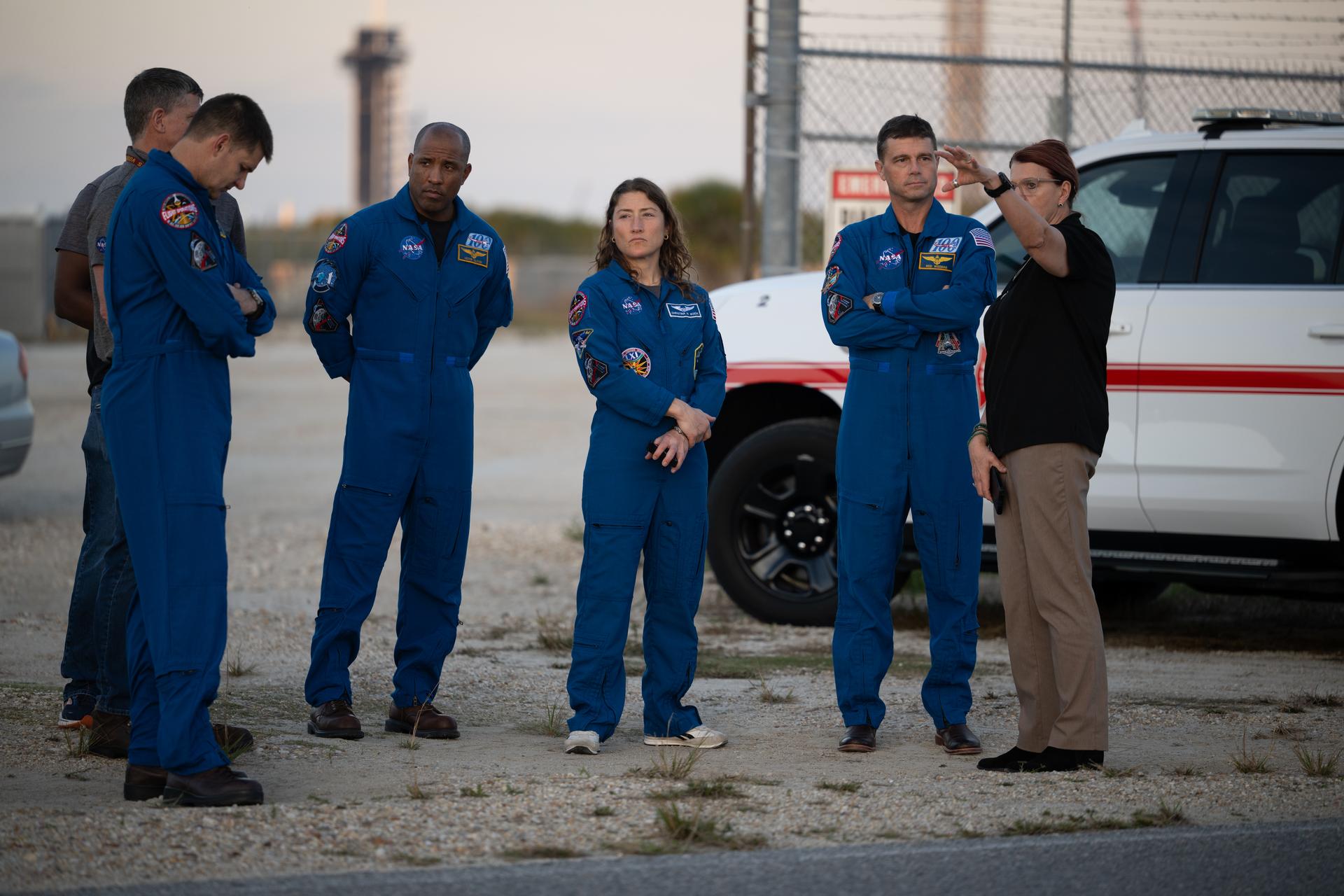 Charlie Blackwell-Thompson, Artemis II Launch Director, right, talks to NASA astronauts Reid Wiseman, Artemis II commander, second from right, Christina Koch, Artemis II mission specialist, Victor Glover, Artemis II pilot, and CSA (Canadian Space Agency) astronaut Jeremy Hansen, as teams at NASA's Kennedy Space Center in Florida practiced various emergency rescue training scenarios with the Artemis II crew, Friday, Dec. 19, 2025, ahead of the Artemis II mission. In the unlikely event of an emergency during launch countdown at Launch Complex 39B, personnel will be transported in mine-resistant ambush protected vehicles, or MRAPS, from the pad and to one of the triage site locations at Kennedy. Photo Credit: (NASA/Joel Kowsky)