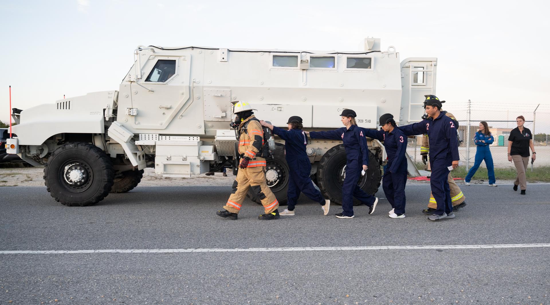 Teams at NASA's Kennedy Space Center in Florida practiced various emergency rescue training scenarios with the Artemis II crew, Friday, Dec. 19, 2025, ahead of the Artemis II mission. In the unlikely event of an emergency during launch countdown at Launch Complex 39B, personnel will be transported in mine-resistant ambush protected vehicles, or MRAPS, from the pad and to one of the triage site locations at Kennedy. Photo Credit: (NASA/Joel Kowsky)