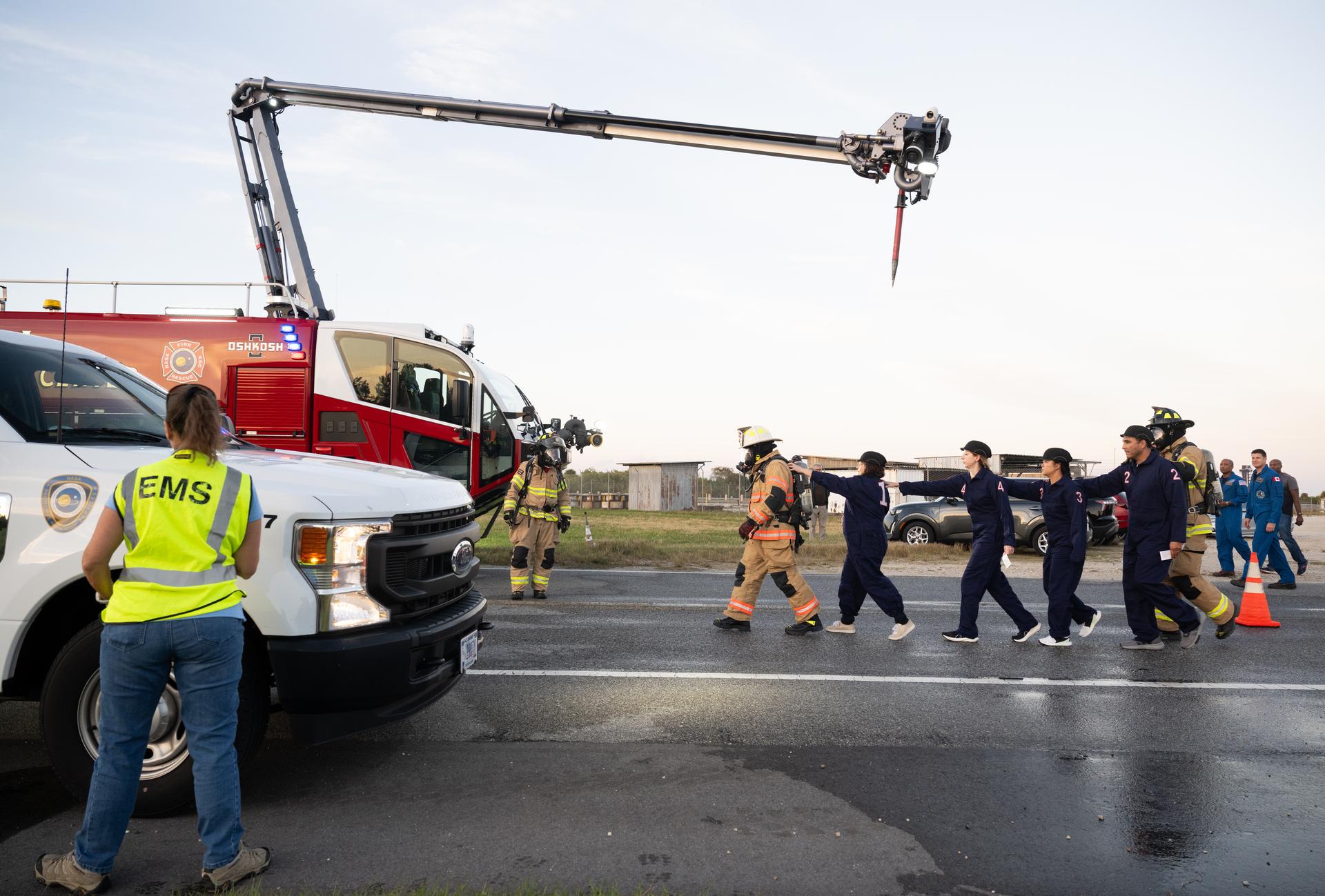 Teams at NASA's Kennedy Space Center in Florida practiced various emergency rescue training scenarios with the Artemis II crew, Friday, Dec. 19, 2025, ahead of the Artemis II mission. In the unlikely event of an emergency during launch countdown at Launch Complex 39B, personnel will be transported in mine-resistant ambush protected vehicles, or MRAPS, from the pad and to one of the triage site locations at Kennedy. Photo Credit: (NASA/Joel Kowsky)