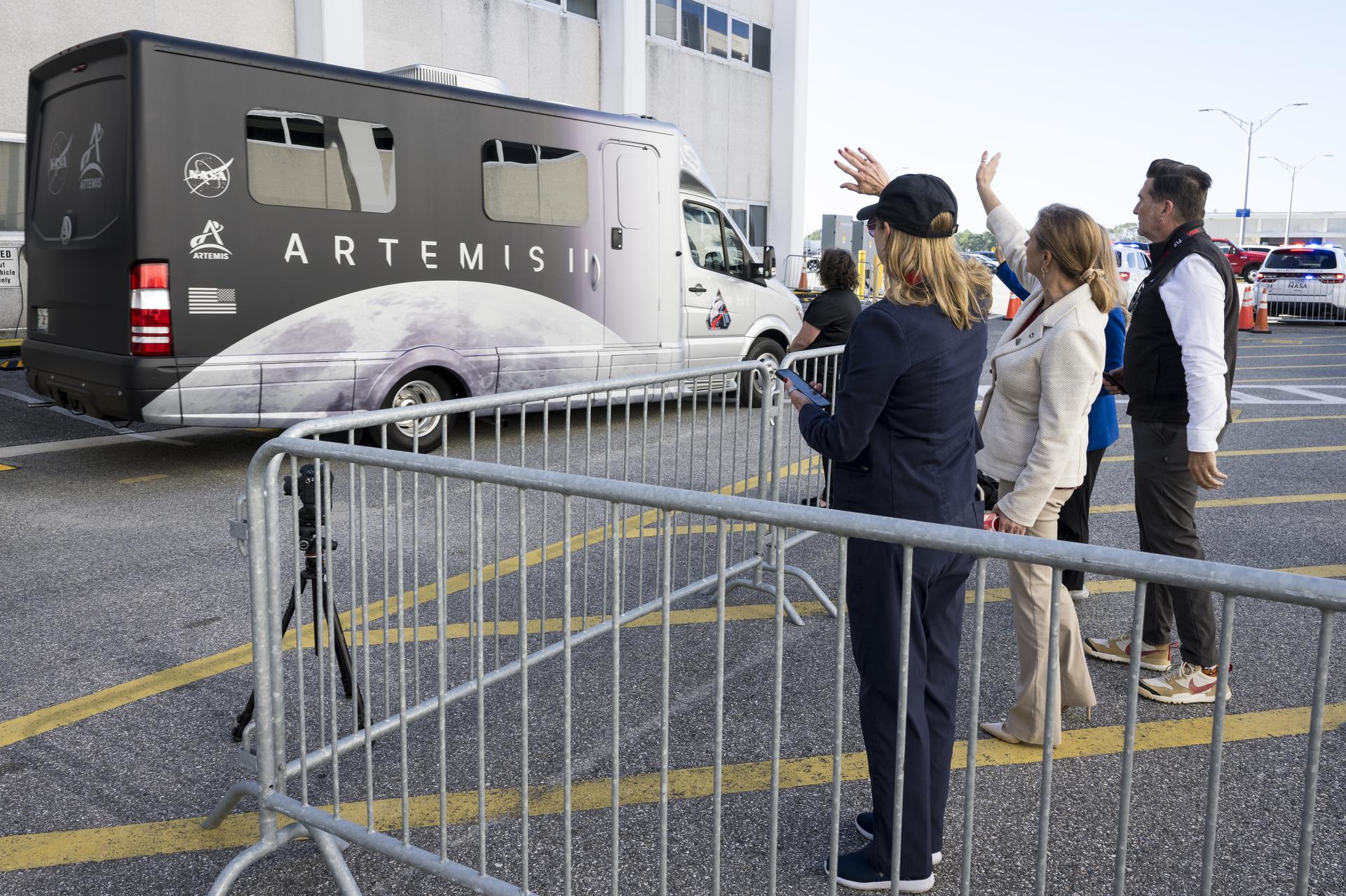 From left to right, Janet Petro, director of NASA's Kennedy Space Center, Lori Glaze, associate administrator for NASA's Exploration Systems Development Mission Directorate,  Adam Steltzner, engineering advisor to the NASA Associate Administrator, and Stephanie Schierholz, chief of staff for NASA's Exploration Systems Development Mission Directorate, wave goodbye to NASA astronauts Reid Wiseman, commander; Victor Glover, pilot; Christina Koch, mission specialist; and CSA (Canadian Space Agency) astronaut Jeremy Hansen, mission specialist as they depart the Neil A. Armstrong Operations and Checkout Building to board their Orion spacecraft atop NASA’s Space Launch System rocket inside the Vehicle Assembly Building as part of the Artemis II countdown demonstration test, Saturday, Dec. 20, 2025, at NASA’s Kennedy Space Center in Florida. For this operation, the Artemis II crew and launch teams are simulating the launch day timeline including suit-up, walkout, and spacecraft ingress and egress. Through the Artemis campaign, NASA will send astronauts to explore the Moon for scientific discovery, economic benefits, and to build the foundation for the first crewed missions to Mars, for the benefit of all. Photo Credit: (NASA/Aubrey Gemignani)