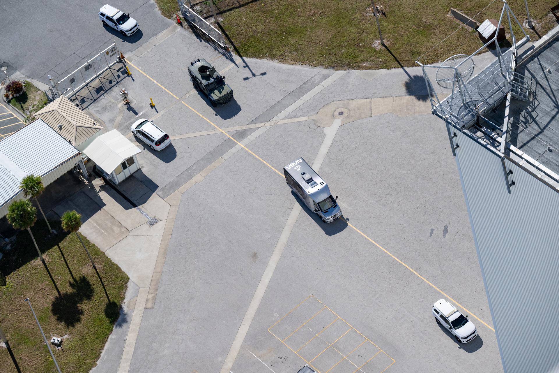 The astronaut transport vehicle carrying Artemis II crewmembers NASA astronauts Reid Wiseman, commander; Victor Glover, pilot; Christina Koch, mission specialist; and CSA (Canadian Space Agency) astronaut Jeremy Hansen, mission specialist is seen as it approaches the Vehicle Assembly Building during the Artemis II countdown demonstration test, Saturday, Dec. 20, 2025, at NASA’s Kennedy Space Center in Florida. For this operation, the Artemis II crew and launch teams are simulating the launch day timeline including suit-up, walkout, and spacecraft ingress and egress. Through the Artemis campaign, NASA will send astronauts to explore the Moon for scientific discovery, economic benefits, and to build the foundation for the first crewed missions to Mars, for the benefit of all. Photo Credit: (NASA/Keegan Barber)
