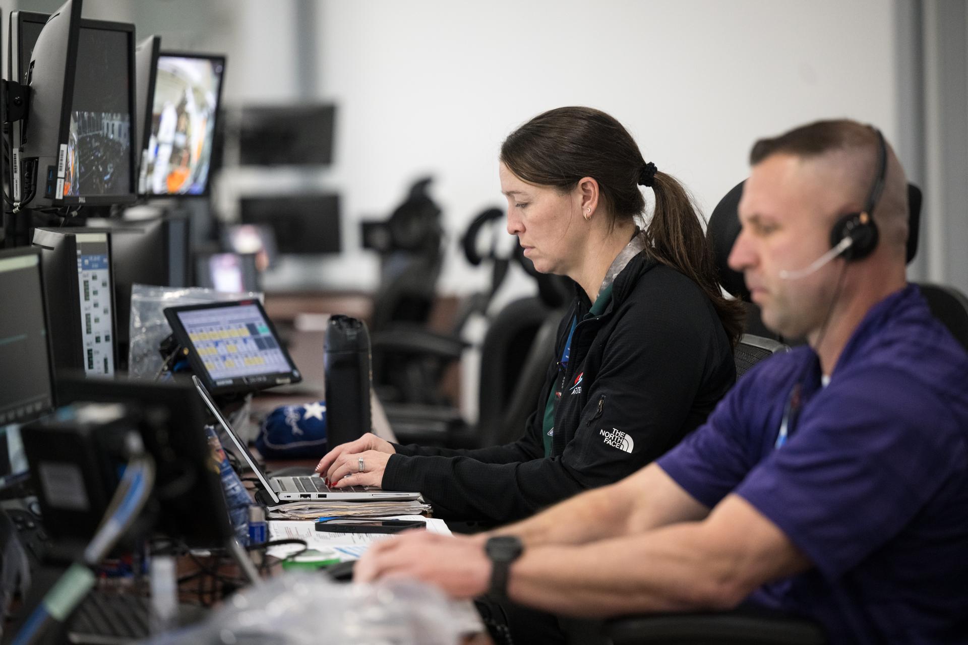 Teams monitor the progress of a Countdown Demonstration Test with Artemis II crewmembers NASA astronauts Reid Wiseman, commander; Victor Glover, pilot; Christina Koch, mission specialist; and CSA (Canadian Space Agency) astronaut Jeremy Hansen, mission specialist onboard their Orion spacecraft from Firing Room 2 of the Rocco A. Petrone Launch Control Center, Saturday, Dec. 20, 2025, at NASA’s Kennedy Space Center in Florida. For this operation, the Artemis II crew and launch teams are simulating the launch day timeline including suit-up, walkout, and spacecraft ingress and egress.  Through the Artemis campaign, NASA will send astronauts to explore the Moon for scientific discovery, economic benefits, and to build the foundation for the first crewed missions to Mars, for the benefit of all. Photo Credit: (NASA/Aubrey Gemignani)