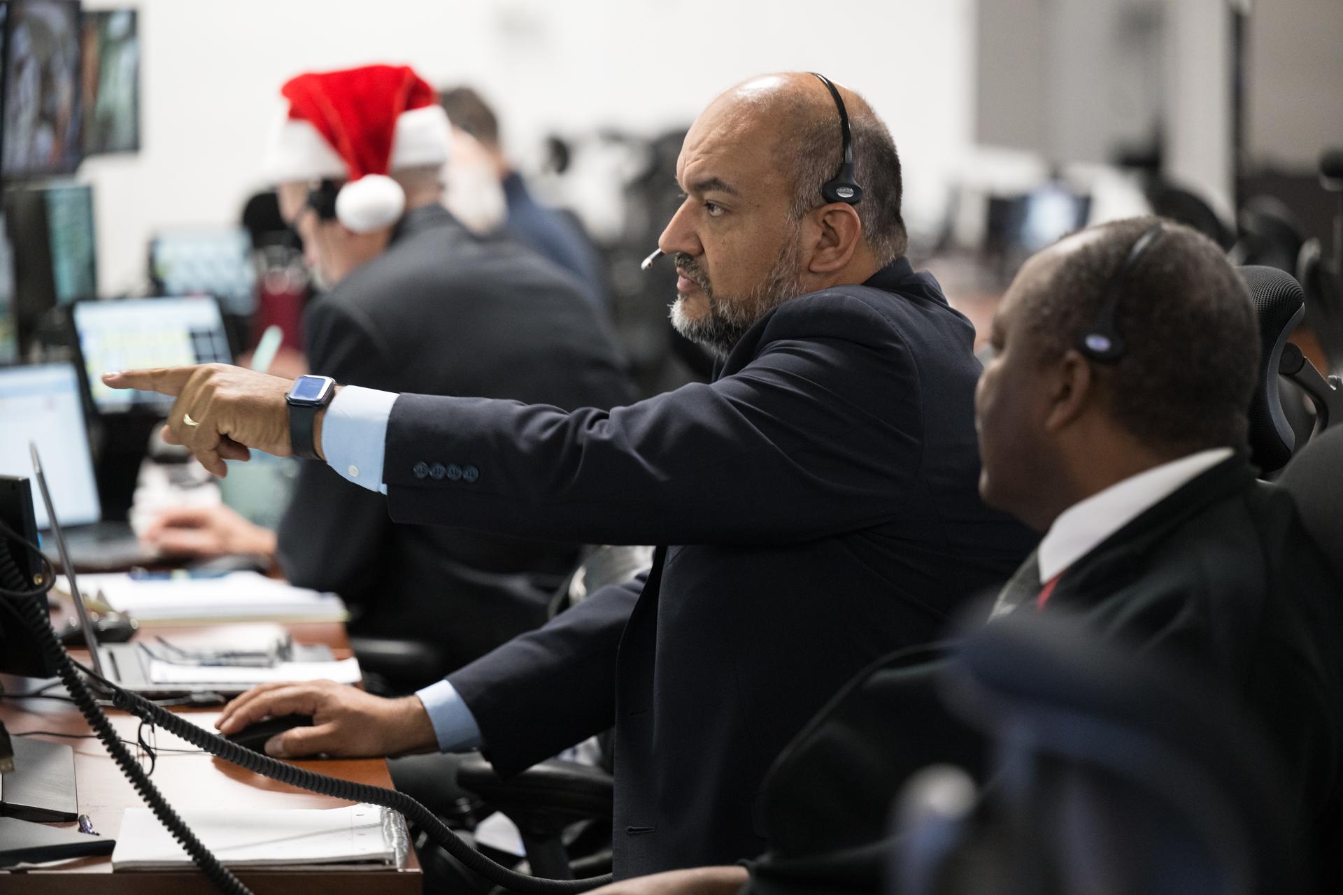 Teams monitor the progress of a Countdown Demonstration Test with Artemis II crewmembers NASA astronauts Reid Wiseman, commander; Victor Glover, pilot; Christina Koch, mission specialist; and CSA (Canadian Space Agency) astronaut Jeremy Hansen, mission specialist onboard their Orion spacecraft from Firing Room 2 of the Rocco A. Petrone Launch Control Center, Saturday, Dec. 20, 2025, at NASA’s Kennedy Space Center in Florida. For this operation, the Artemis II crew and launch teams are simulating the launch day timeline including suit-up, walkout, and spacecraft ingress and egress.  Through the Artemis campaign, NASA will send astronauts to explore the Moon for scientific discovery, economic benefits, and to build the foundation for the first crewed missions to Mars, for the benefit of all. Photo Credit: (NASA/Aubrey Gemignani)