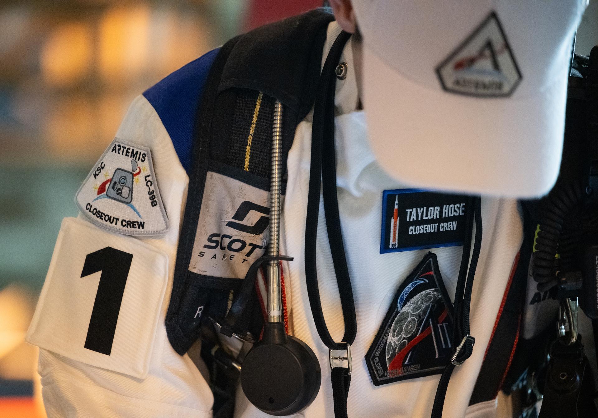 Taylor Hose, Closeout Crew lead, is seen as he prepares for the arrival of Artemis II crewmembers NASA astronauts Reid Wiseman, commander; Victor Glover, pilot; Christina Koch, mission specialist; and CSA (Canadian Space Agency) astronaut Jeremy Hansen, mission specialist; at the 275-foot level of the mobile launcher to board their Orion spacecraft atop NASA’s Space Launch System rocket during the Artemis II countdown demonstration test, Saturday, Dec. 20, 2025, inside the Vehicle Assembly Building at NASA’s Kennedy Space Center in Florida. For this operation, the Artemis II crew and launch teams are simulating the launch day timeline including suit-up, walkout, and spacecraft ingress and egress.  Through the Artemis campaign, NASA will send astronauts to explore the Moon for scientific discovery, economic benefits, and to build the foundation for the first crewed missions to Mars, for the benefit of all. Photo Credit: (NASA/Joel Kowsky)