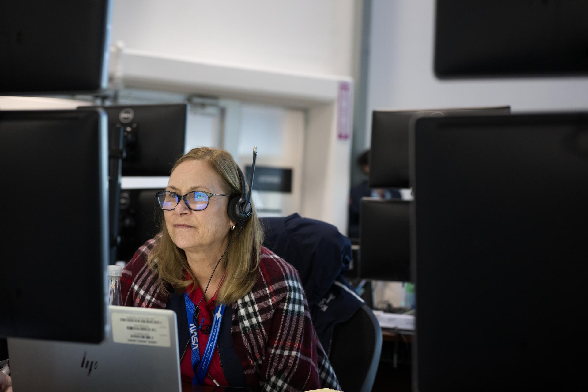 Janet Petro, director of NASA's Kennedy Space Center, monitors the progress of a Countdown Demonstration Test with Artemis II crewmembers NASA astronauts Reid Wiseman, commander; Victor Glover, pilot; Christina Koch, mission specialist; and CSA (Canadian Space Agency) astronaut Jeremy Hansen, mission specialist onboard their Orion spacecraft from Firing Room 2 of the Rocco A. Petrone Launch Control Center, Saturday, Dec. 20, 2025, at NASA’s Kennedy Space Center in Florida. For this operation, the Artemis II crew and launch teams are simulating the launch day timeline including suit-up, walkout, and spacecraft ingress and egress.  Through the Artemis campaign, NASA will send astronauts to explore the Moon for scientific discovery, economic benefits, and to build the foundation for the first crewed missions to Mars, for the benefit of all. Photo Credit: (NASA/Aubrey Gemignani)