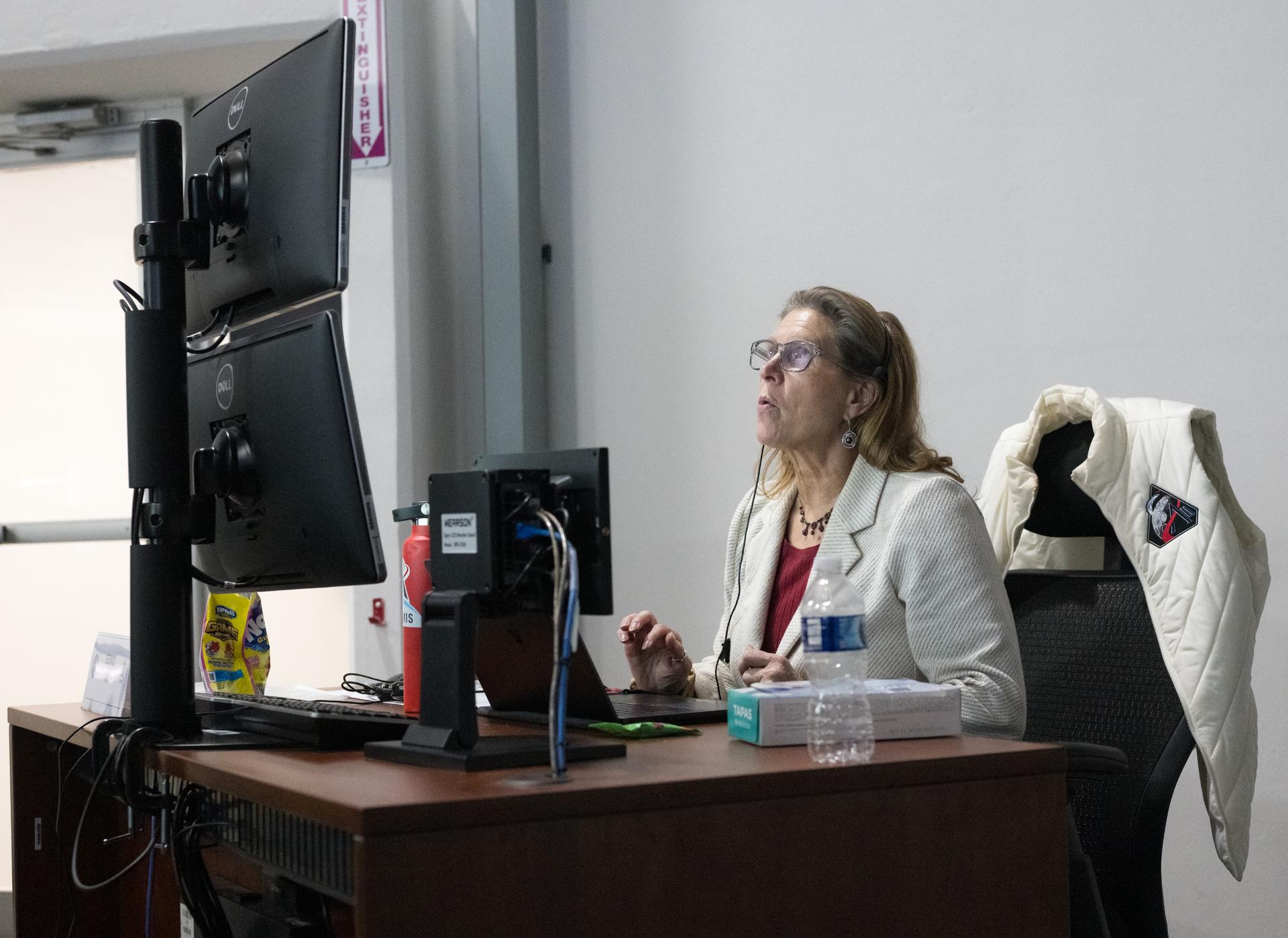 Lori Glaze, acting associate administrator for NASA's Exploration Systems Development Mission Directorate monitors the progress of a Countdown Demonstration Test with Artemis II crewmembers NASA astronauts Reid Wiseman, commander; Victor Glover, pilot; Christina Koch, mission specialist; and CSA (Canadian Space Agency) astronaut Jeremy Hansen, mission specialist onboard their Orion spacecraft from Firing Room 2 of the Rocco A. Petrone Launch Control Center, Saturday, Dec. 20, 2025, at NASA’s Kennedy Space Center in Florida. For this operation, the Artemis II crew and launch teams are simulating the launch day timeline including suit-up, walkout, and spacecraft ingress and egress.  Through the Artemis campaign, NASA will send astronauts to explore the Moon for scientific discovery, economic benefits, and to build the foundation for the first crewed missions to Mars, for the benefit of all. Photo Credit: (NASA/Aubrey Gemignani)