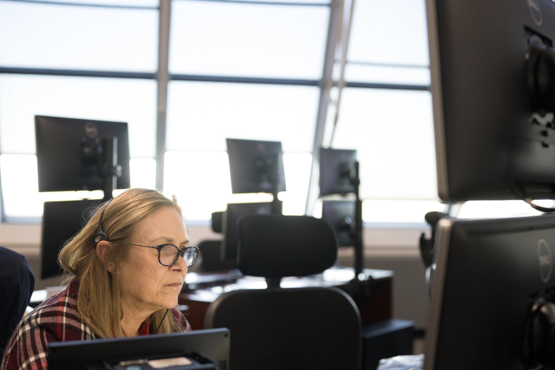 Janet Petro, director of NASA's Kennedy Space Center, monitors the progress of a Countdown Demonstration Test with Artemis II crewmembers NASA astronauts Reid Wiseman, commander; Victor Glover, pilot; Christina Koch, mission specialist; and CSA (Canadian Space Agency) astronaut Jeremy Hansen, mission specialist onboard their Orion spacecraft from Firing Room 2 of the Rocco A. Petrone Launch Control Center, Saturday, Dec. 20, 2025, at NASA’s Kennedy Space Center in Florida. For this operation, the Artemis II crew and launch teams are simulating the launch day timeline including suit-up, walkout, and spacecraft ingress and egress.  Through the Artemis campaign, NASA will send astronauts to explore the Moon for scientific discovery, economic benefits, and to build the foundation for the first crewed missions to Mars, for the benefit of all. Photo Credit: (NASA/Aubrey Gemignani)