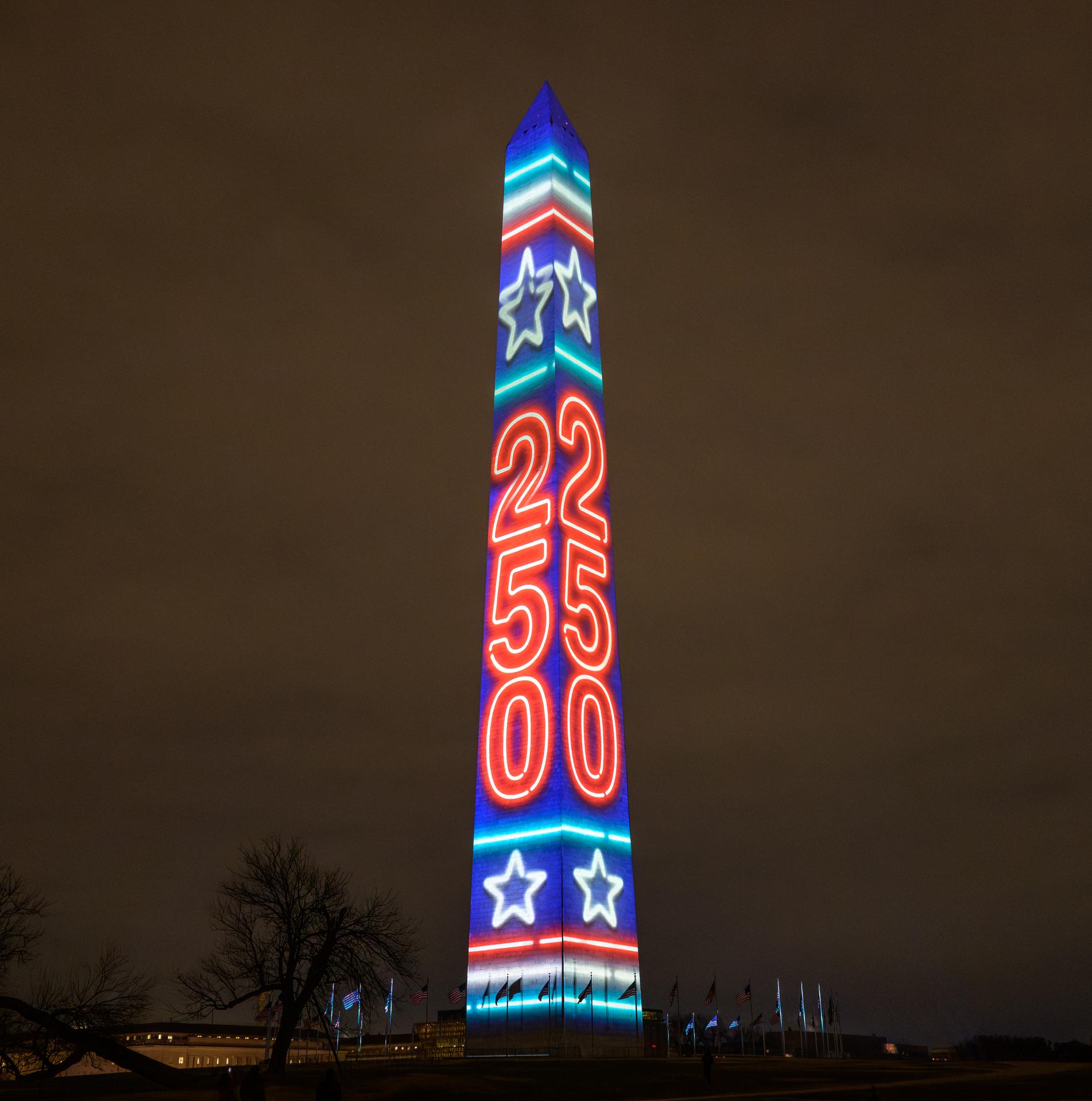 The Washington Monument is lit as part of an event to kick off the nation's 250th birthday year, Wednesday, Dec. 31, 2025, in Washington. Photo Credit: (NASA/Bill Ingalls)