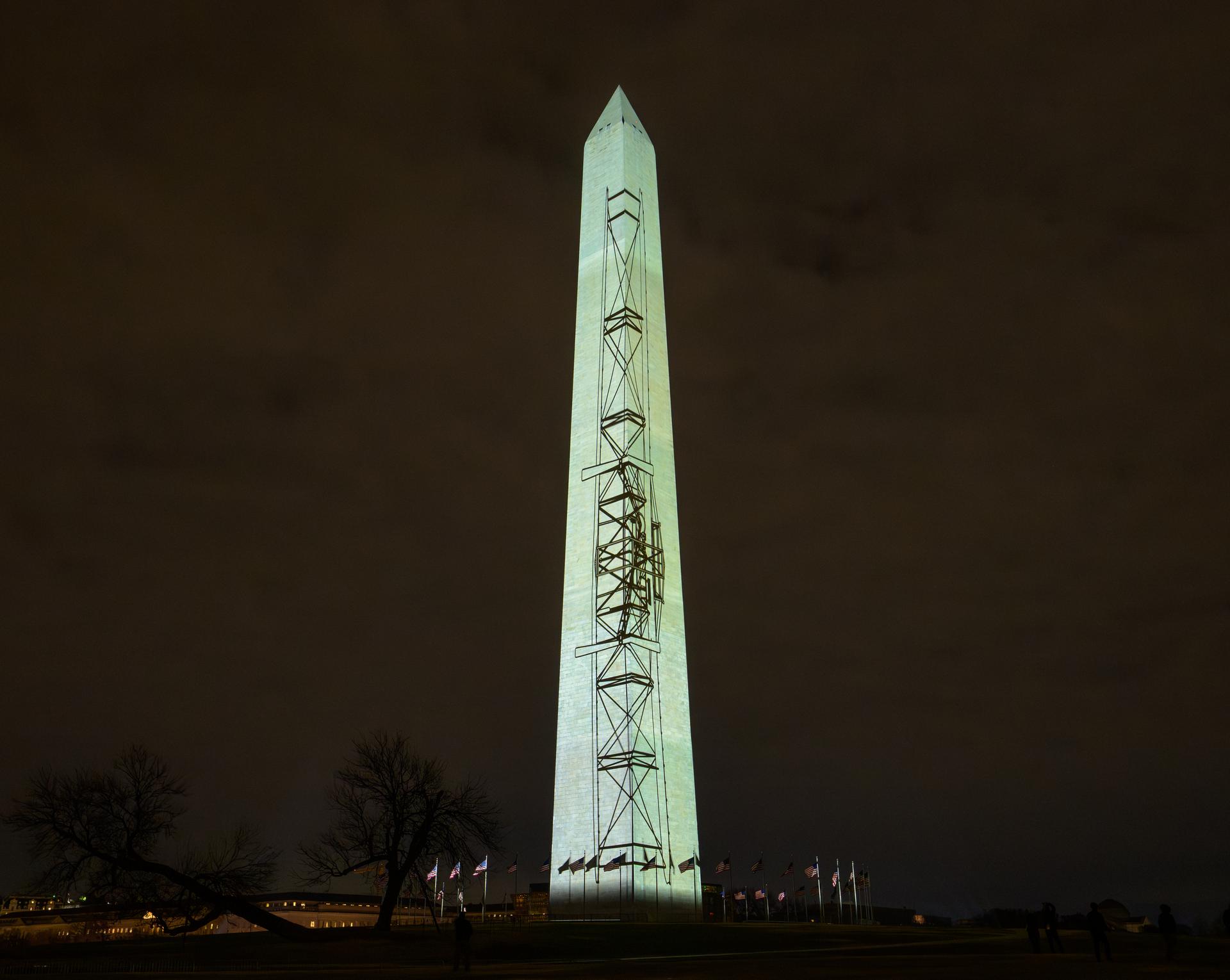 Images depicting the Wright brothers aircraft are projected onto the Washington Monument as part of an event to kick off the nation's 250th birthday year, Wednesday, Dec. 31, 2025, in Washington. Photo Credit: (NASA/Bill Ingalls)