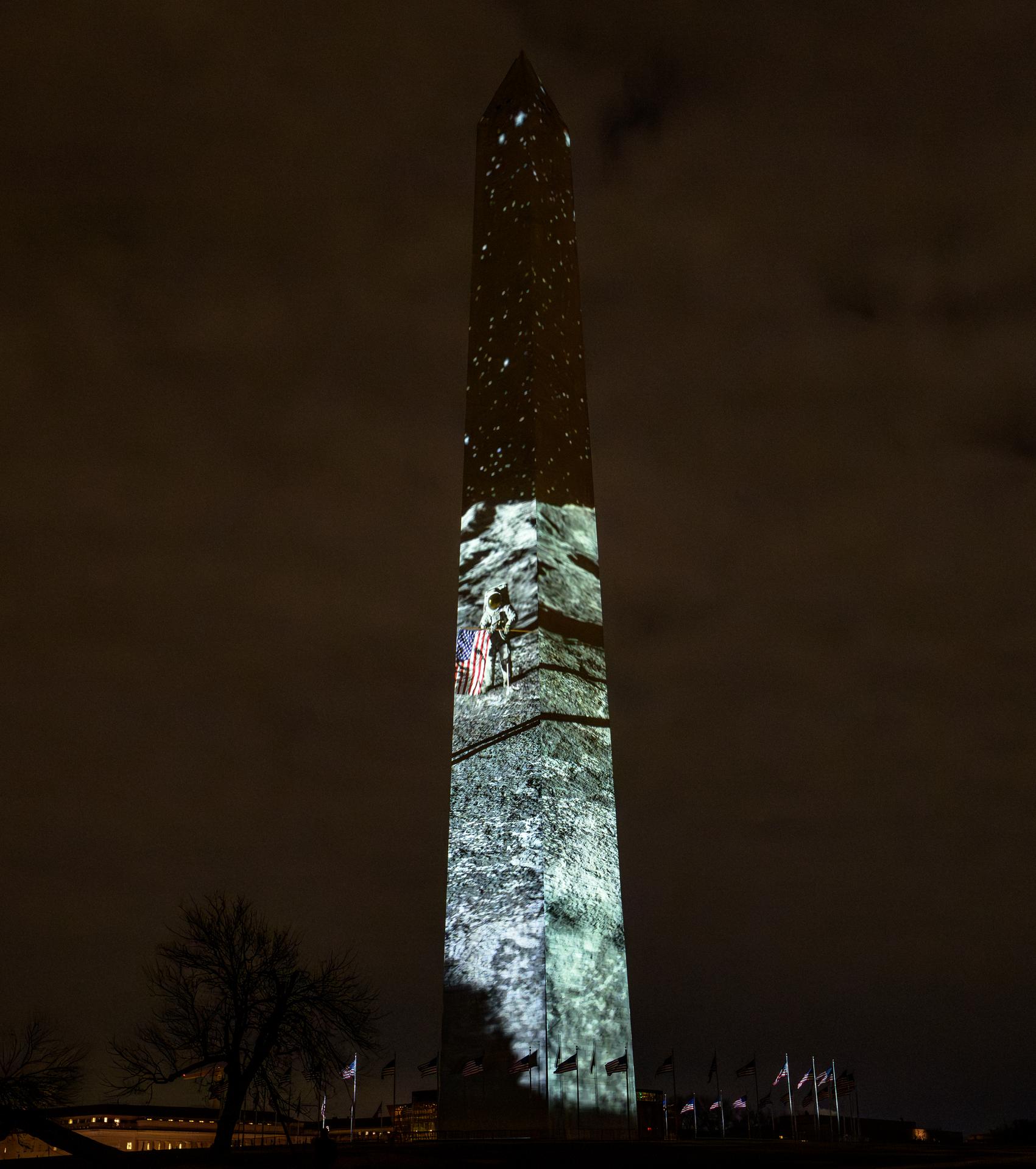 Images depicting NASA Apollo Moon missions are projected onto the Washington Monument as part of an event to kick off the nation's 250th birthday year, Wednesday, Dec. 31, 2025, in Washington. Photo Credit: (NASA/Bill Ingalls)