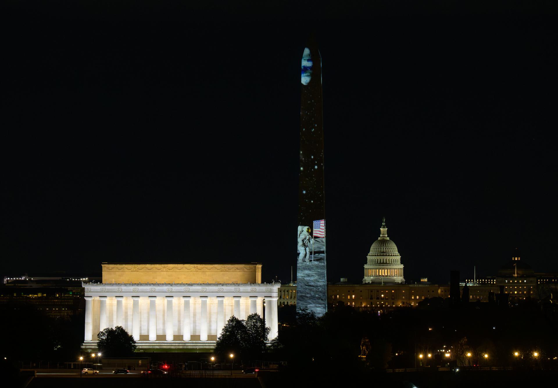 Images depicting NASA Moon missions are projected onto the Washington Monument as part of an event to kick off the nation's 250th birthday year, Wednesday, Dec. 31, 2025, in Washington. Photo Credit: (NASA/Bill Ingalls)