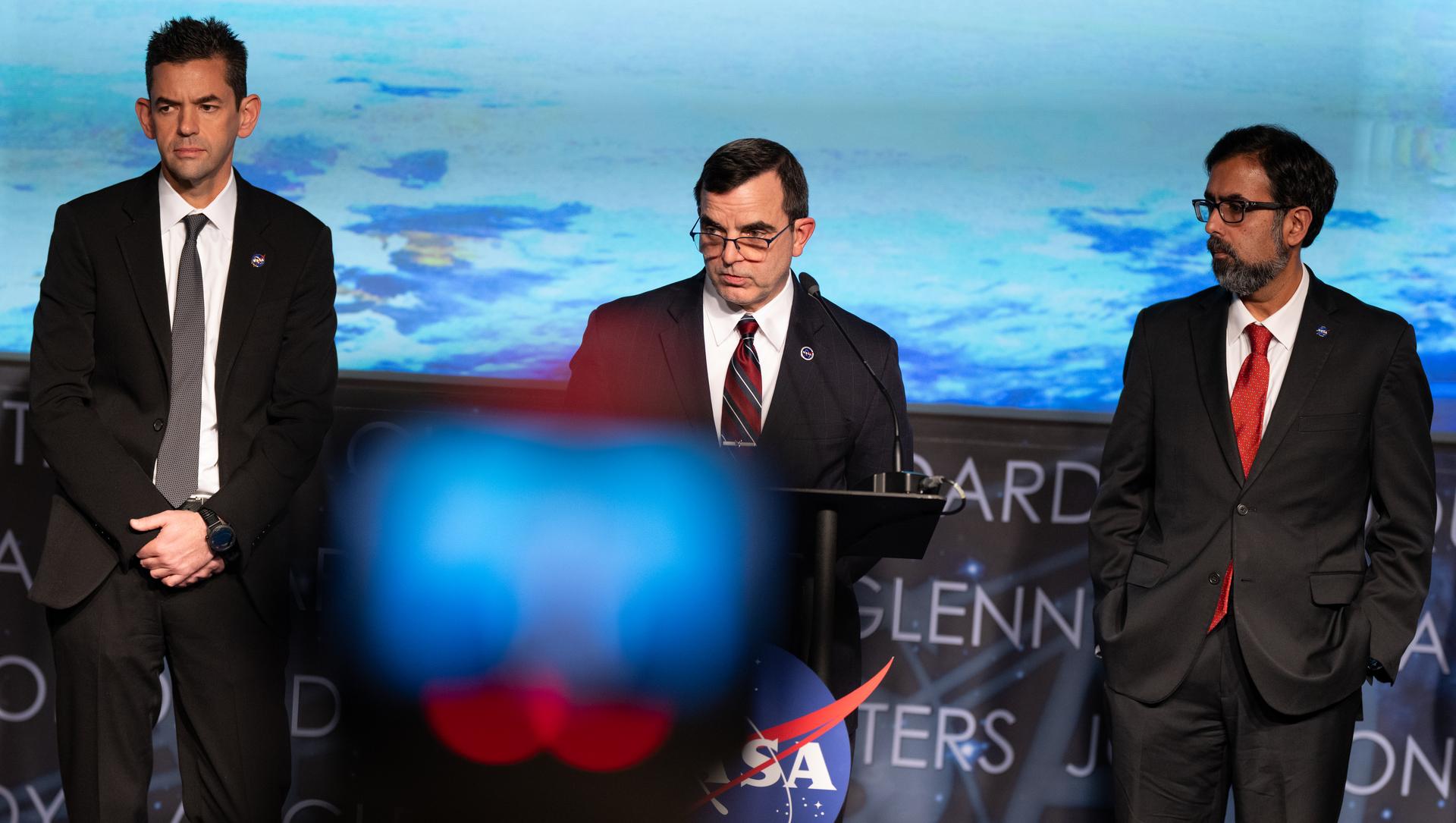 Dr. James Polk, NASA’s chief health and medical officer, center, speaks alongside NASA Administrator Jared Isaacman, left, and Amit Kshatriya, NASA associate administrator, as they provide an update on the International Space Station and its crew, Thursday, Jan. 8, 2026, at the Mary W. Jackson NASA Headquarters building in Washington. Photo Credit: (NASA/Joel Kowsky)