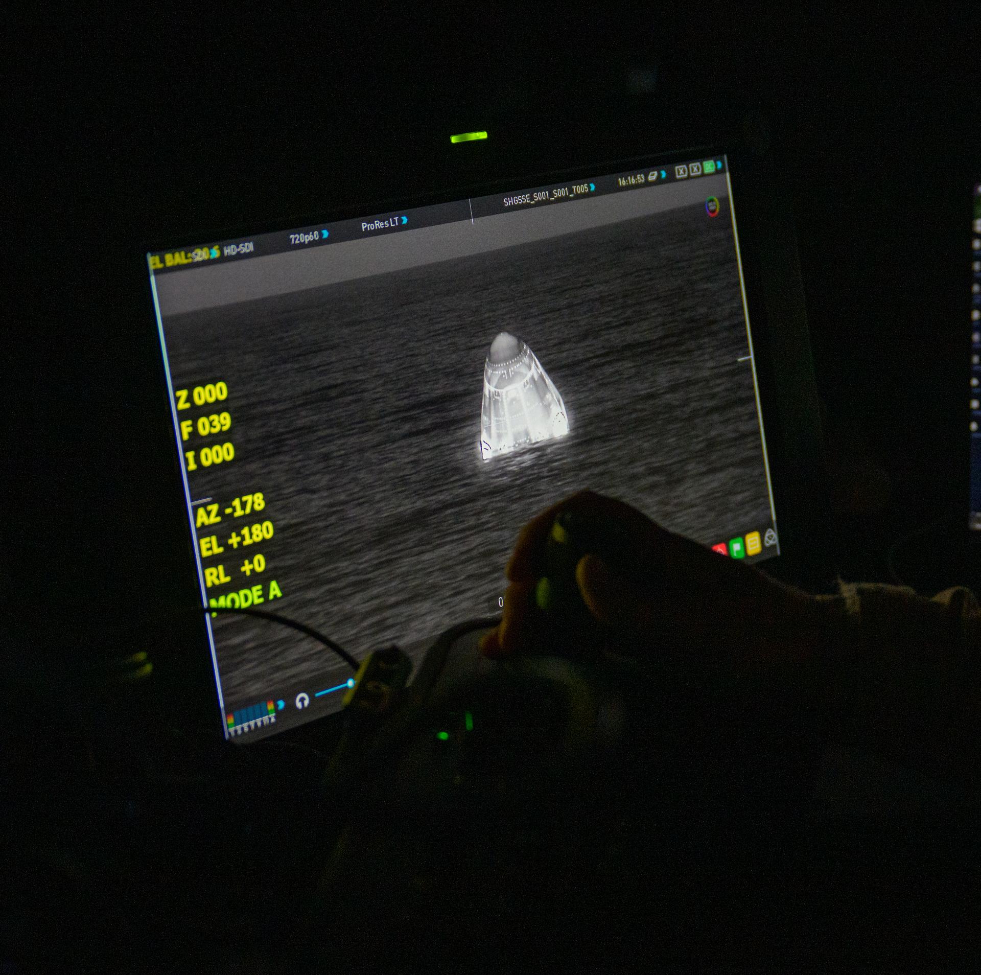 The SpaceX Dragon Endeavour spacecraft is seen on a monitor onboard the ship SHANNON shortly after it landed with NASA astronauts Zena Cardman, Mike Fincke, JAXA (Japan Aerospace Exploration Agency) astronaut Kimiya Yui, and Roscosmos cosmonaut Oleg Platonov aboard in the Pacific Ocean off the coast of San Diego, Calif., Thursday, Jan. 15,2026. Cardman, Fincke, Yui, Platonov are returning after 167 days in space as part of Expedition 74 aboard the International Space Station. Photo Credit: (NASA/Bill Ingalls)