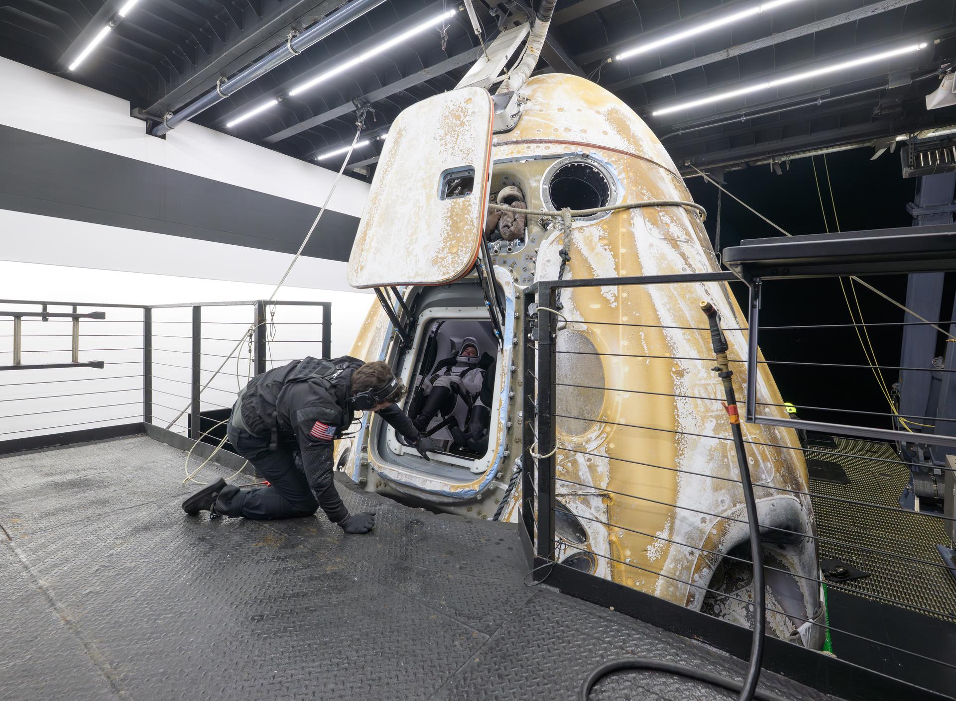Support teams onboard the SpaceX recovery ship SHANNON work around the SpaceX Dragon Endeavour spacecraft after the hatch was opened shortly after it landed with NASA astronauts Zena Cardman, Mike Fincke, JAXA (Japan Aerospace Exploration Agency) astronaut Kimiya Yui, and Roscosmos cosmonaut Oleg Platonov aboard in the Pacific Ocean off the coast of San Diego, Calif., Thursday, Jan. 15, 2026. Cardman, Fincke, Yui, Platonov are returning after 167 days in space as part of Expedition 74 aboard the International Space Station. Photo Credit: (NASA/Bill Ingalls)