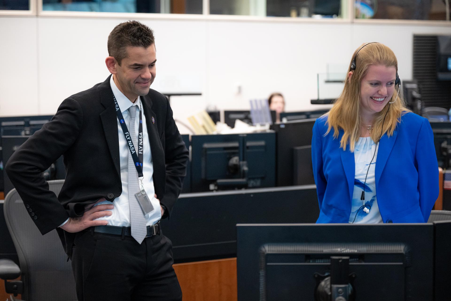 NASA Administrator Jared Isaacman, left, speaks with Rachel Krause, SPARTAN (Station Power, Articulation, Thermal, and Analysis) flight controller, right, Thursday, Jan. 15, 2026, inside the Christopher C. Kraft Jr. Mission Control Center at NASA’s Johnson Space Center in Houston, Texas, following splashdown of the agency’s Crew-11 mission at 3:41 a.m. ET. Photo Credit: (NASA/John Kraus)