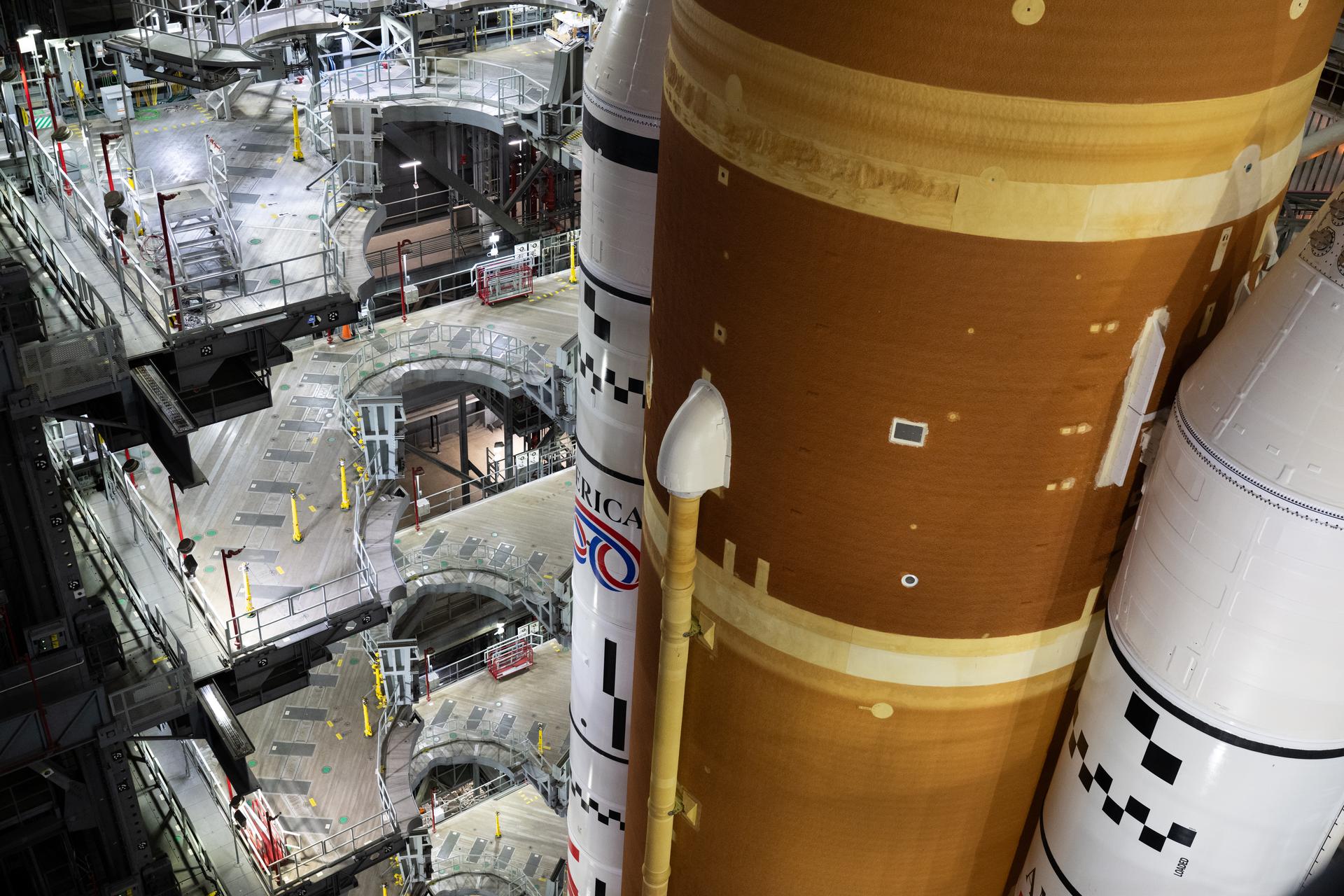 NASA’s Artemis II SLS (Space Launch System) rocket and Orion spacecraft, secured to the mobile launcher, is seen inside the Vehicle Assembly building as preparations continue for rollout to Launch Pad 39B, Friday, Jan. 16, 2026, at NASA’s Kennedy Space Center in Florida. NASA’s Artemis II flight test will take Commander Reid Wiseman, Pilot Victor Glover, and Mission Specialist Christina Koch from NASA, and Mission Specialist Jeremy Hansen from the CSA (Canadian Space Agency), around the Moon and back to Earth no later than April 2026. Photo Credit: (NASA/Joel Kowsky)
