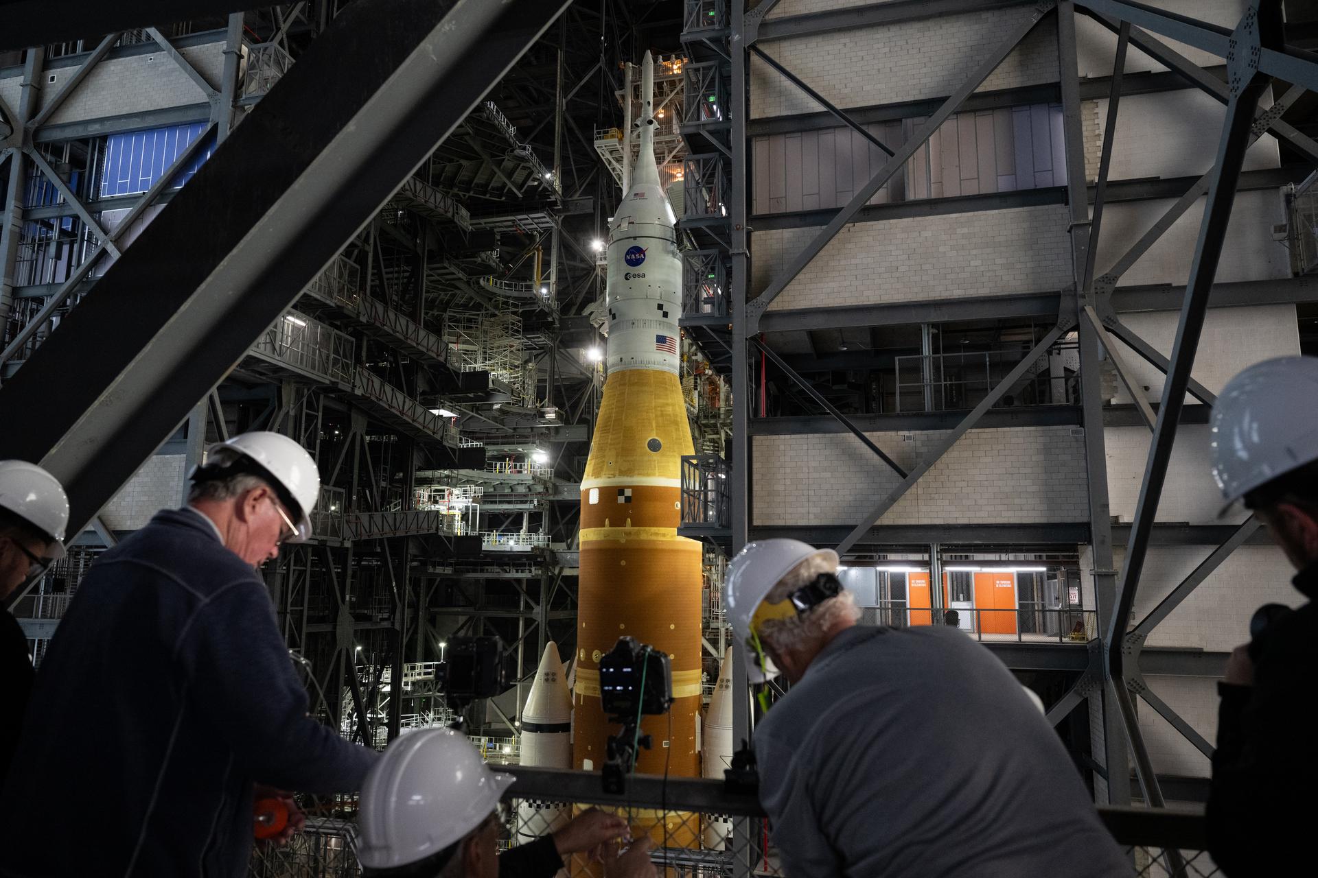 Members of the media are seen as they setup remote cameras to photograph the rollout of NASA’s Artemis II SLS (Space Launch System) rocket and Orion spacecraft inside the Vehicle Assembly building as preparations continue for rollout to Launch Pad 39B, Friday, Jan. 16, 2026, at NASA’s Kennedy Space Center in Florida. NASA’s Artemis II flight test will take Commander Reid Wiseman, Pilot Victor Glover, and Mission Specialist Christina Koch from NASA, and Mission Specialist Jeremy Hansen from the CSA (Canadian Space Agency), around the Moon and back to Earth no later than April 2026. Photo Credit: (NASA/Joel Kowsky)
