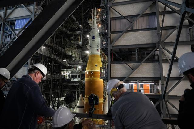 Members of the media are seen as they setup remote cameras to photograph the ...