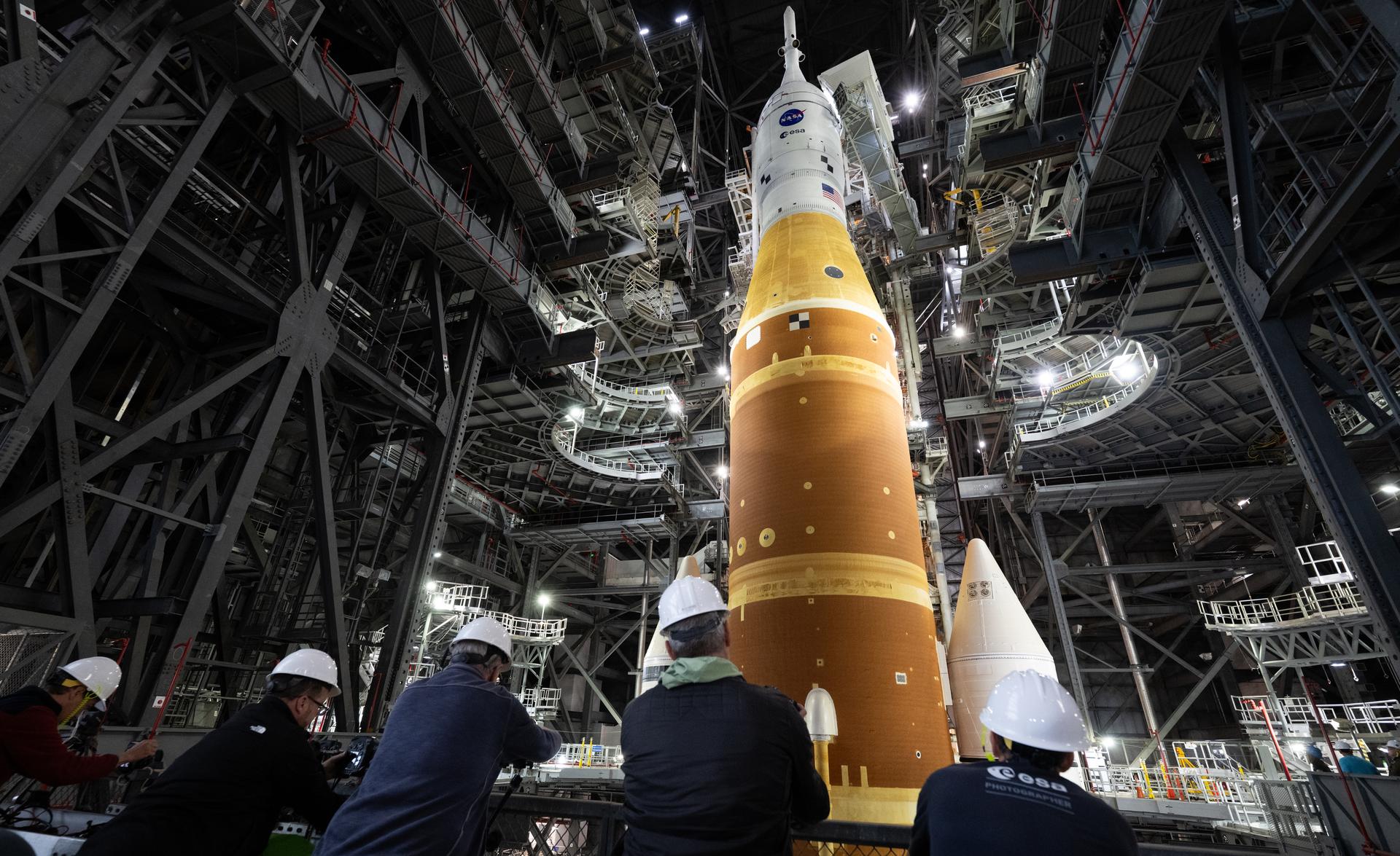 Members of the media are seen as they setup remote cameras to photograph the rollout of NASA’s Artemis II SLS (Space Launch System) rocket and Orion spacecraft inside the Vehicle Assembly building as preparations continue for rollout to Launch Pad 39B, Friday, Jan. 16, 2026, at NASA’s Kennedy Space Center in Florida. NASA’s Artemis II flight test will take Commander Reid Wiseman, Pilot Victor Glover, and Mission Specialist Christina Koch from NASA, and Mission Specialist Jeremy Hansen from the CSA (Canadian Space Agency), around the Moon and back to Earth no later than April 2026. Photo Credit: (NASA/Joel Kowsky)