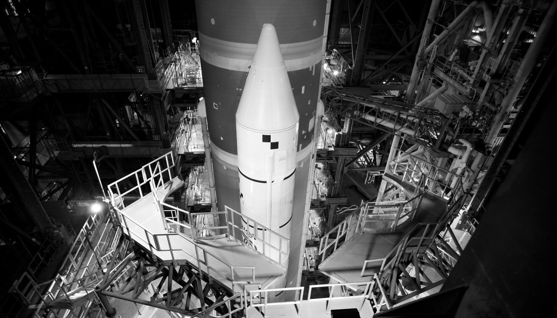 NASA’s Artemis II SLS (Space Launch System) rocket and Orion spacecraft, secured to the mobile launcher, is seen  inside the Vehicle Assembly building as preparations continue for rollout to Launch Pad 39B, Friday, Jan. 16, 2026, at NASA’s Kennedy Space Center in Florida. NASA’s Artemis II flight test will take Commander Reid Wiseman, Pilot Victor Glover, and Mission Specialist Christina Koch from NASA, and Mission Specialist Jeremy Hansen from the CSA (Canadian Space Agency), around the Moon and back to Earth no later than April 2026. Photo Credit: (NASA/Joel Kowsky)