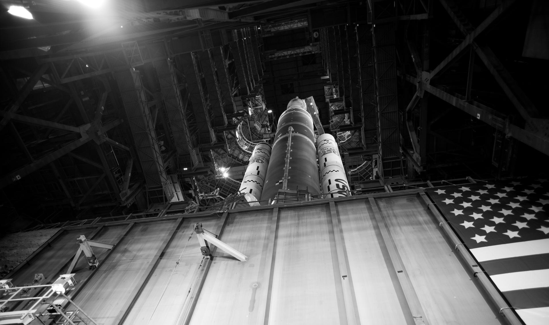 NASA’s Artemis II SLS (Space Launch System) rocket and Orion spacecraft, secured to the mobile launcher, is seen  inside the Vehicle Assembly building as preparations continue for rollout to Launch Pad 39B, Friday, Jan. 16, 2026, at NASA’s Kennedy Space Center in Florida. NASA’s Artemis II flight test will take Commander Reid Wiseman, Pilot Victor Glover, and Mission Specialist Christina Koch from NASA, and Mission Specialist Jeremy Hansen from the CSA (Canadian Space Agency), around the Moon and back to Earth no later than April 2026. Photo Credit: (NASA/Joel Kowsky)