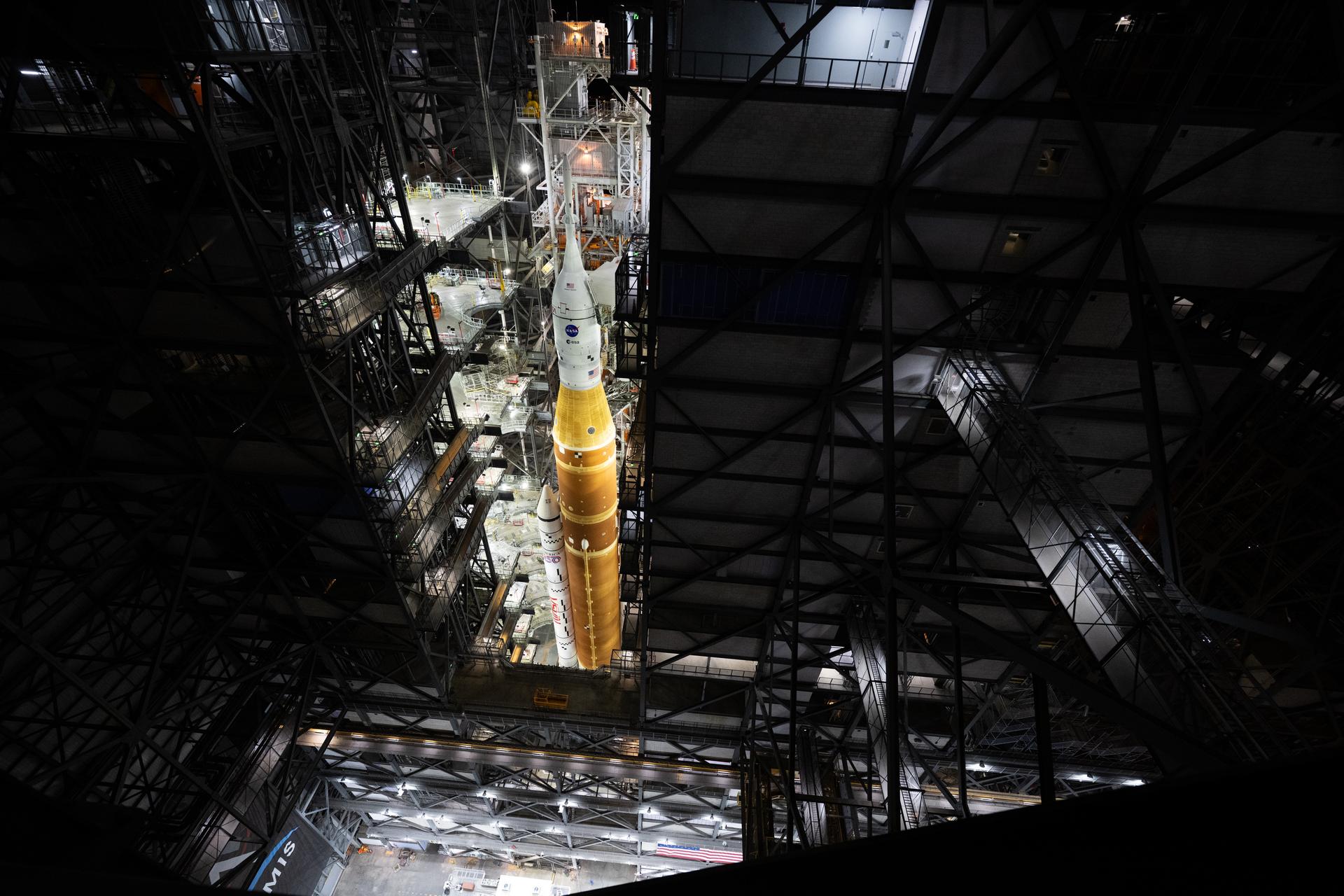The mobile launcher with NASA’s Artemis II Space Launch System (SLS) rocket and Orion spacecraft secured to it is seen inside the Vehicle Assembly Building following the opening of the doors before rolling out to Launch Pad 39B, Saturday, Jan. 17, 2026, at NASA’s Kennedy Space Center in Florida. NASA’s Artemis II test flight will take Commander Reid Wiseman, Pilot Victor Glover, and Mission Specialist Christina Koch from NASA, and Mission Specialist Jeremy Hansen from the CSA (Canadian Space Agency), around the Moon and back to Earth no later than April 2026. Photo Credit: (NASA/Joel Kowsky)