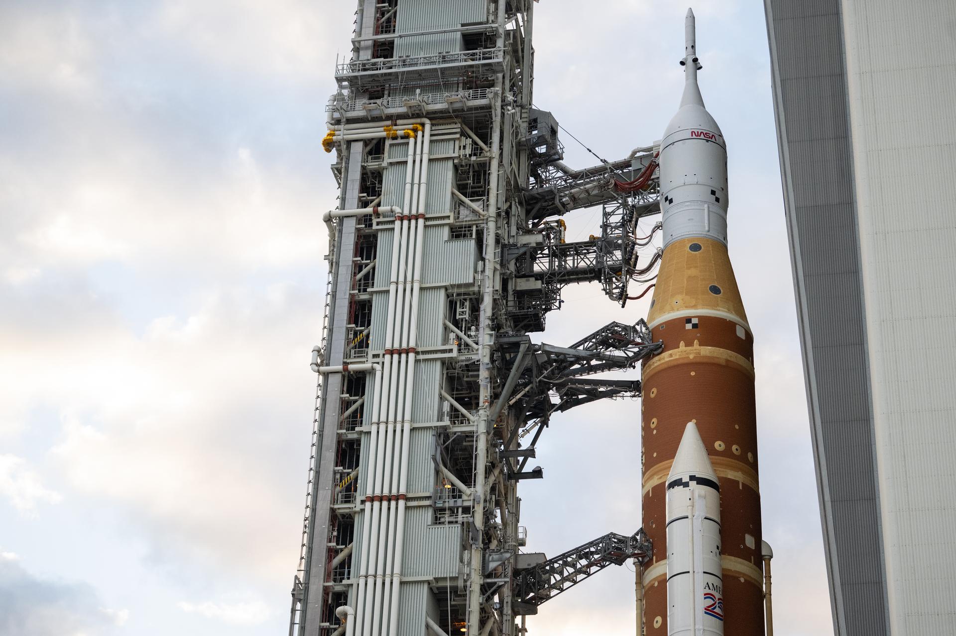 NASA’s Space Launch System (SLS) rocket and Orion spacecraft, secured to the mobile launcher, is seen as it rolls out of the Vehicle Assembly Building to Launch Pad 39B, Sat, Jan. 17, 2026, at NASA’s Kennedy Space Center in Florida. NASA’s Artemis II test flight will take Commander Reid Wiseman, Pilot Victor Glover, and Mission Specialist Christina Koch from NASA, and Mission Specialist Jeremy Hansen from the CSA (Canadian Space Agency), around the Moon and back to Earth no later than no later than April 2026. Photo Credit: (NASA/Joel Kowsky)