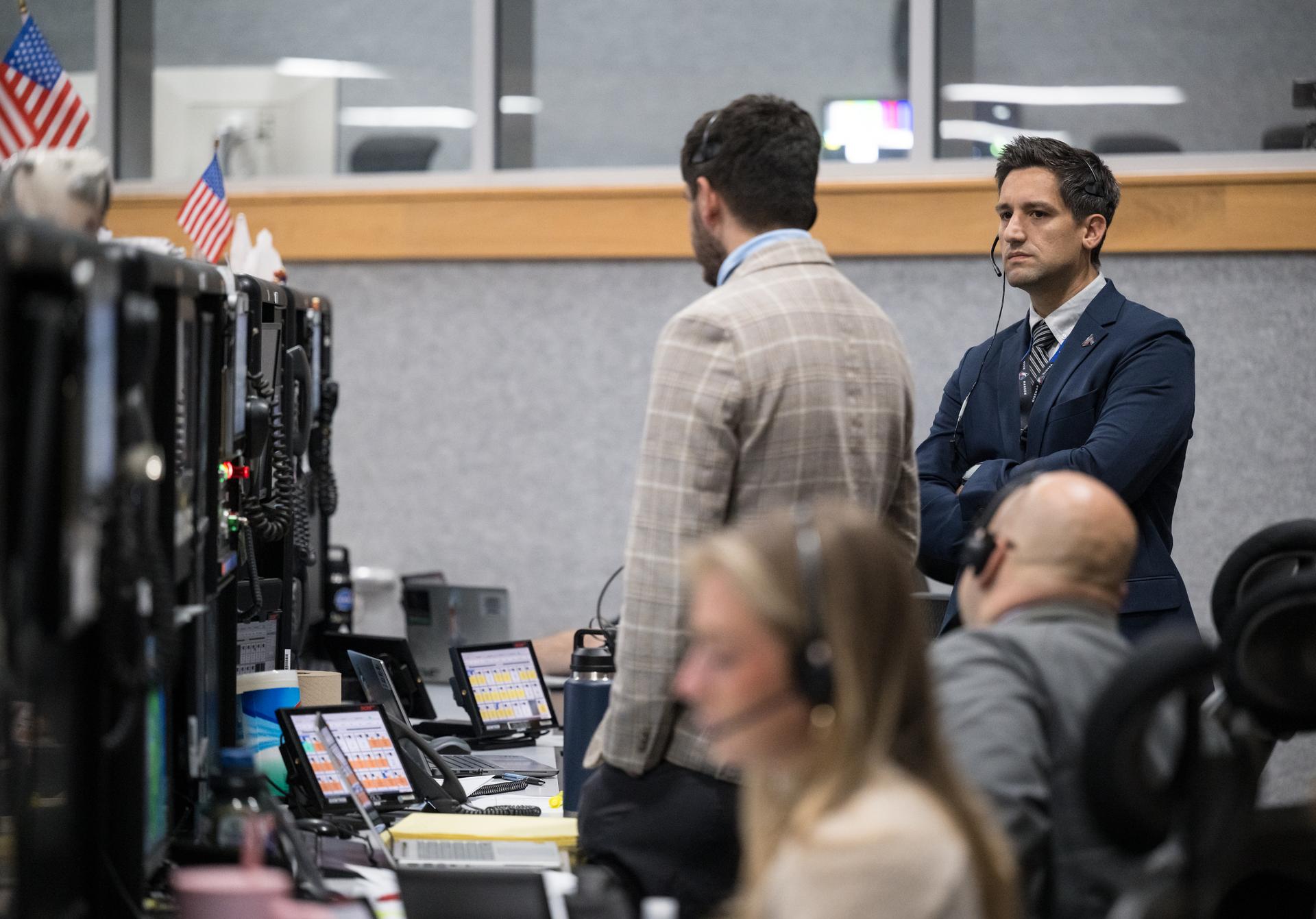 Members of the Artemis II launch team are seen on console in Firing Room One of the Rocco A. Petrone Launch Control Center as NASA’s Artemis II Space Launch System (SLS) rocket and Orion spacecraft, secured to the mobile launcher, roll out of High Bay 3 of the Vehicle Assembly Building to Launch Complex 39B, Saturday, Jan. 17, 2026, at NASA’s Kennedy Space Center in Florida. NASA’s Artemis II test flight will take Commander Reid Wiseman, Pilot Victor Glover, and Mission Specialist Christina Koch from NASA, and Mission Specialist Jeremy Hansen from the CSA (Canadian Space Agency), around the Moon and back to Earth no later than April 2026. Photo Credit: (NASA/Aubrey Gemignani)