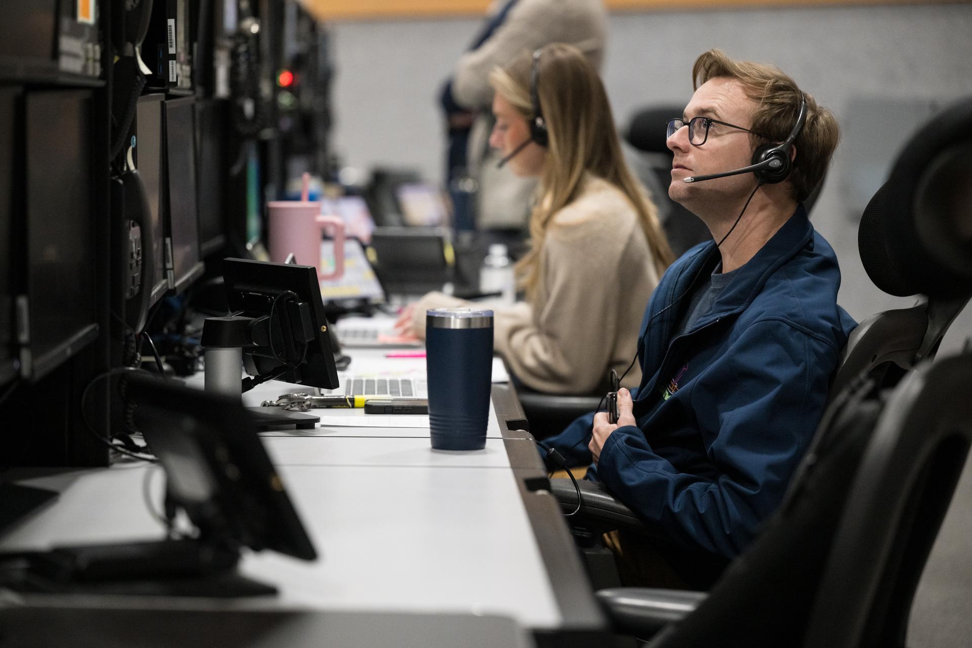 Members of the Artemis II launch team are seen on console in Firing Room One of the Rocco A. Petrone Launch Control Center as NASA’s Artemis II Space Launch System (SLS) rocket and Orion spacecraft, secured to the mobile launcher, roll out of High Bay 3 of the Vehicle Assembly Building to Launch Complex 39B, Saturday, Jan. 17, 2026, at NASA’s Kennedy Space Center in Florida. NASA’s Artemis II test flight will take Commander Reid Wiseman, Pilot Victor Glover, and Mission Specialist Christina Koch from NASA, and Mission Specialist Jeremy Hansen from the CSA (Canadian Space Agency), around the Moon and back to Earth no later than April 2026. Photo Credit: (NASA/Aubrey Gemignani)