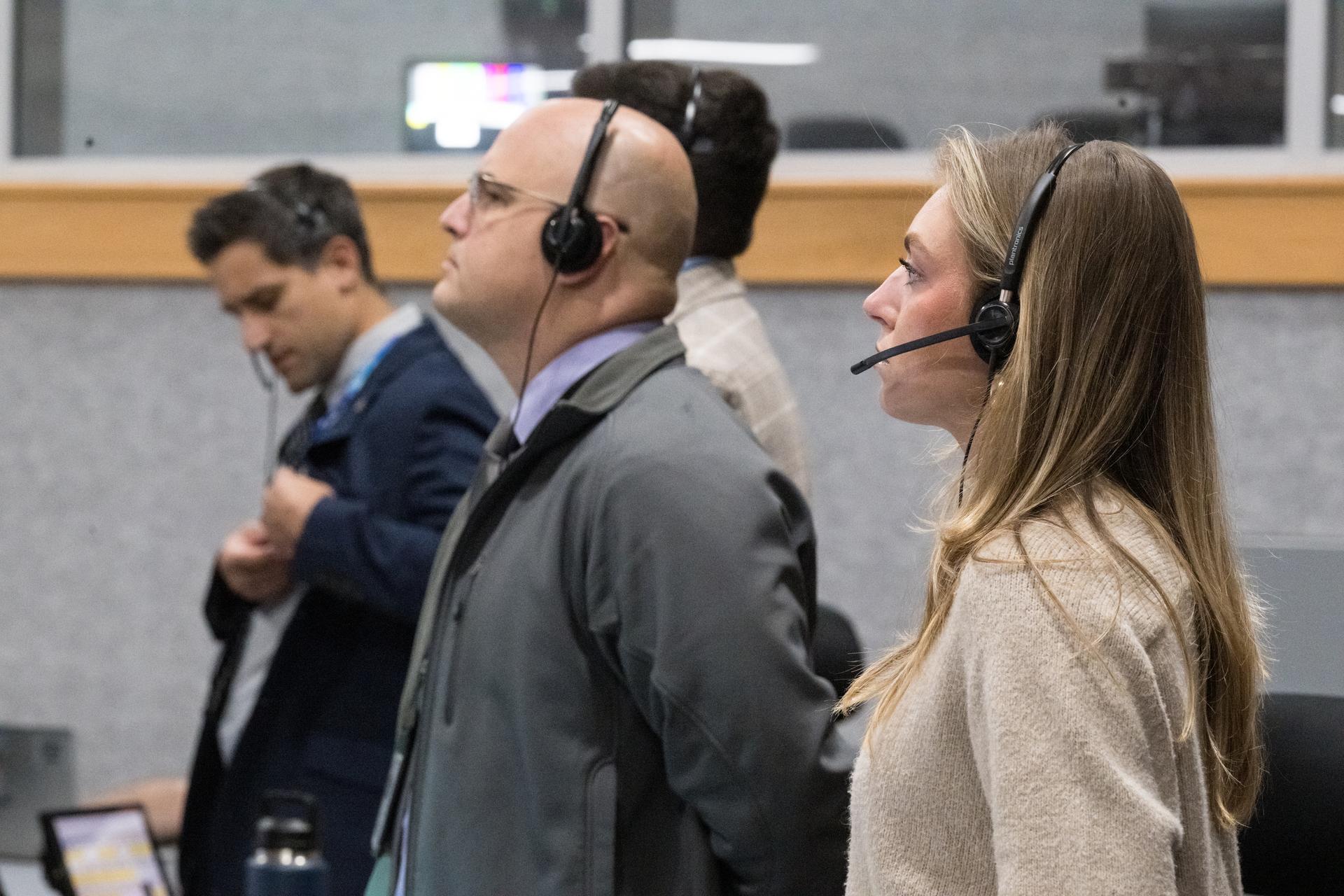 Members of the Artemis II launch team are seen on console in Firing Room One of the Rocco A. Petrone Launch Control Center as NASA’s Artemis II Space Launch System (SLS) rocket and Orion spacecraft, secured to the mobile launcher, roll out of High Bay 3 of the Vehicle Assembly Building to Launch Complex 39B, Saturday, Jan. 17, 2026, at NASA’s Kennedy Space Center in Florida. NASA’s Artemis II test flight will take Commander Reid Wiseman, Pilot Victor Glover, and Mission Specialist Christina Koch from NASA, and Mission Specialist Jeremy Hansen from the CSA (Canadian Space Agency), around the Moon and back to Earth no later than April 2026. Photo Credit: (NASA/Aubrey Gemignani)