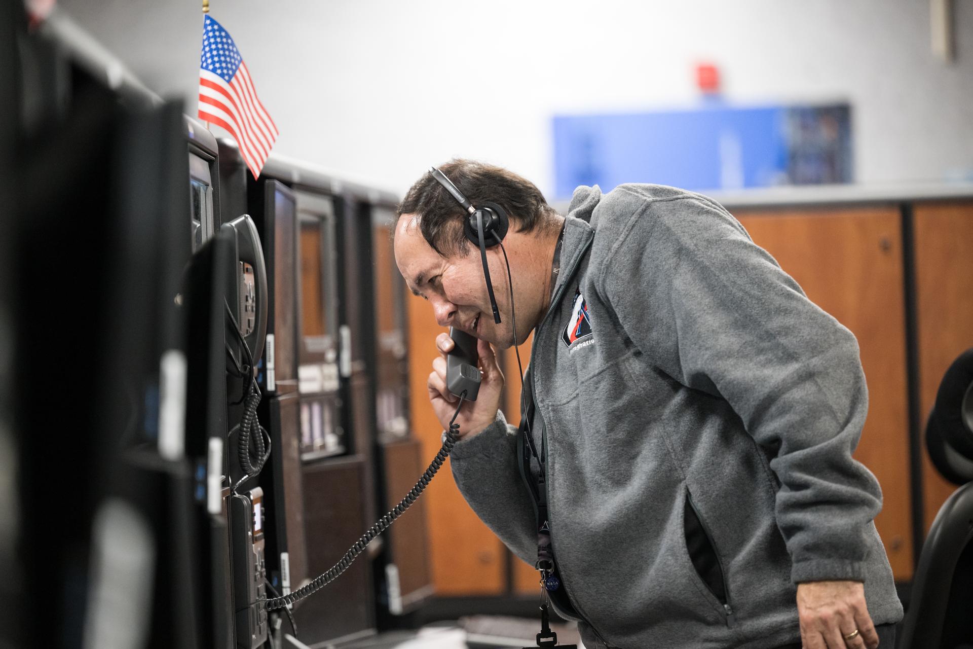 Members of the Artemis II launch team are seen on console in Firing Room One of the Rocco A. Petrone Launch Control Center as NASA’s Artemis II Space Launch System (SLS) rocket and Orion spacecraft, secured to the mobile launcher, roll out of High Bay 3 of the Vehicle Assembly Building to Launch Complex 39B, Saturday, Jan. 17, 2026, at NASA’s Kennedy Space Center in Florida. NASA’s Artemis II test flight will take Commander Reid Wiseman, Pilot Victor Glover, and Mission Specialist Christina Koch from NASA, and Mission Specialist Jeremy Hansen from the CSA (Canadian Space Agency), around the Moon and back to Earth no later than April 2026. Photo Credit: (NASA/Aubrey Gemignani)