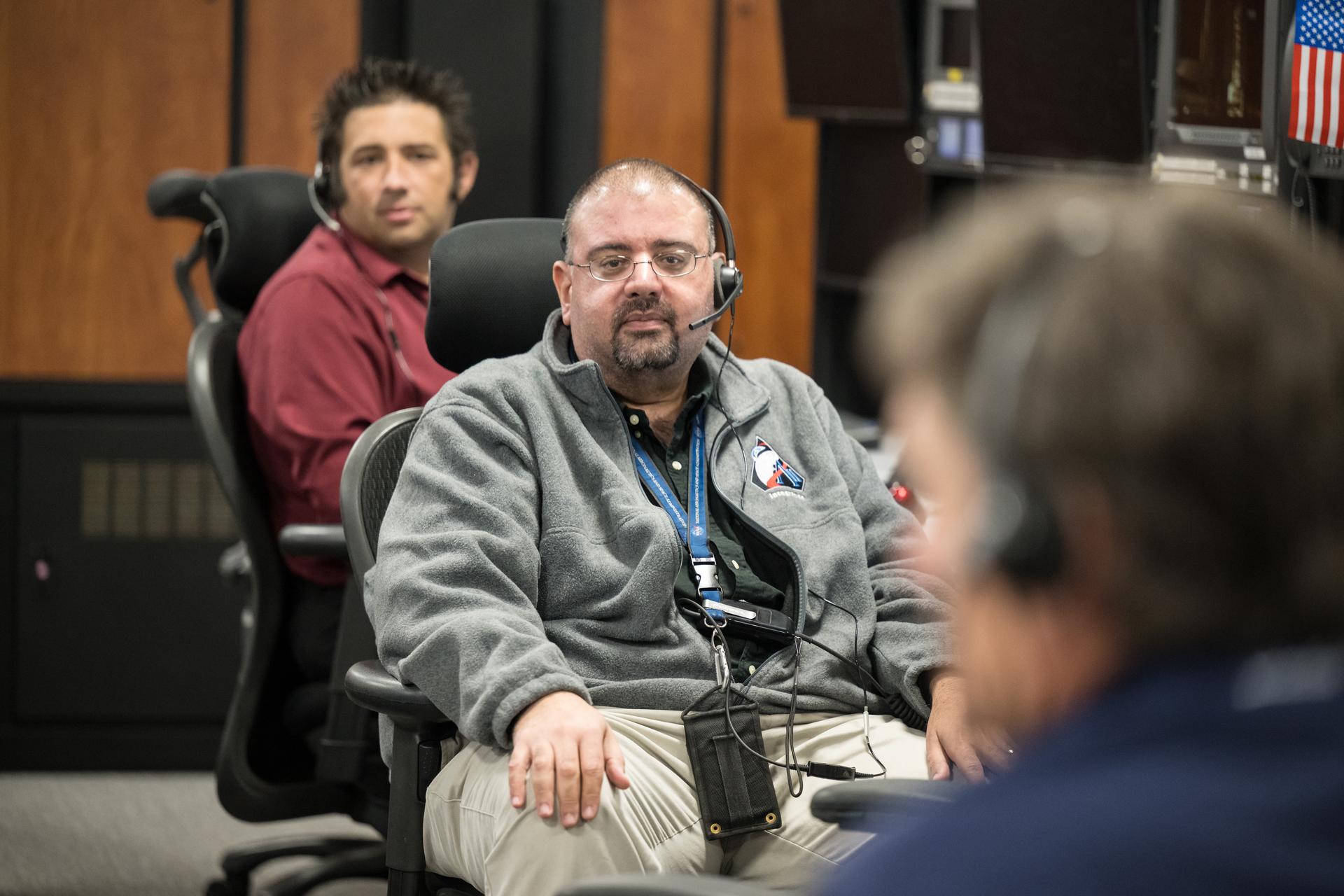 Members of the Artemis II launch team are seen on console in Firing Room One of the Rocco A. Petrone Launch Control Center as NASA’s Artemis II Space Launch System (SLS) rocket and Orion spacecraft, secured to the mobile launcher, roll out of High Bay 3 of the Vehicle Assembly Building to Launch Complex 39B, Saturday, Jan. 17, 2026, at NASA’s Kennedy Space Center in Florida. NASA’s Artemis II test flight will take Commander Reid Wiseman, Pilot Victor Glover, and Mission Specialist Christina Koch from NASA, and Mission Specialist Jeremy Hansen from the CSA (Canadian Space Agency), around the Moon and back to Earth no later than April 2026. Photo Credit: (NASA/Aubrey Gemignani)