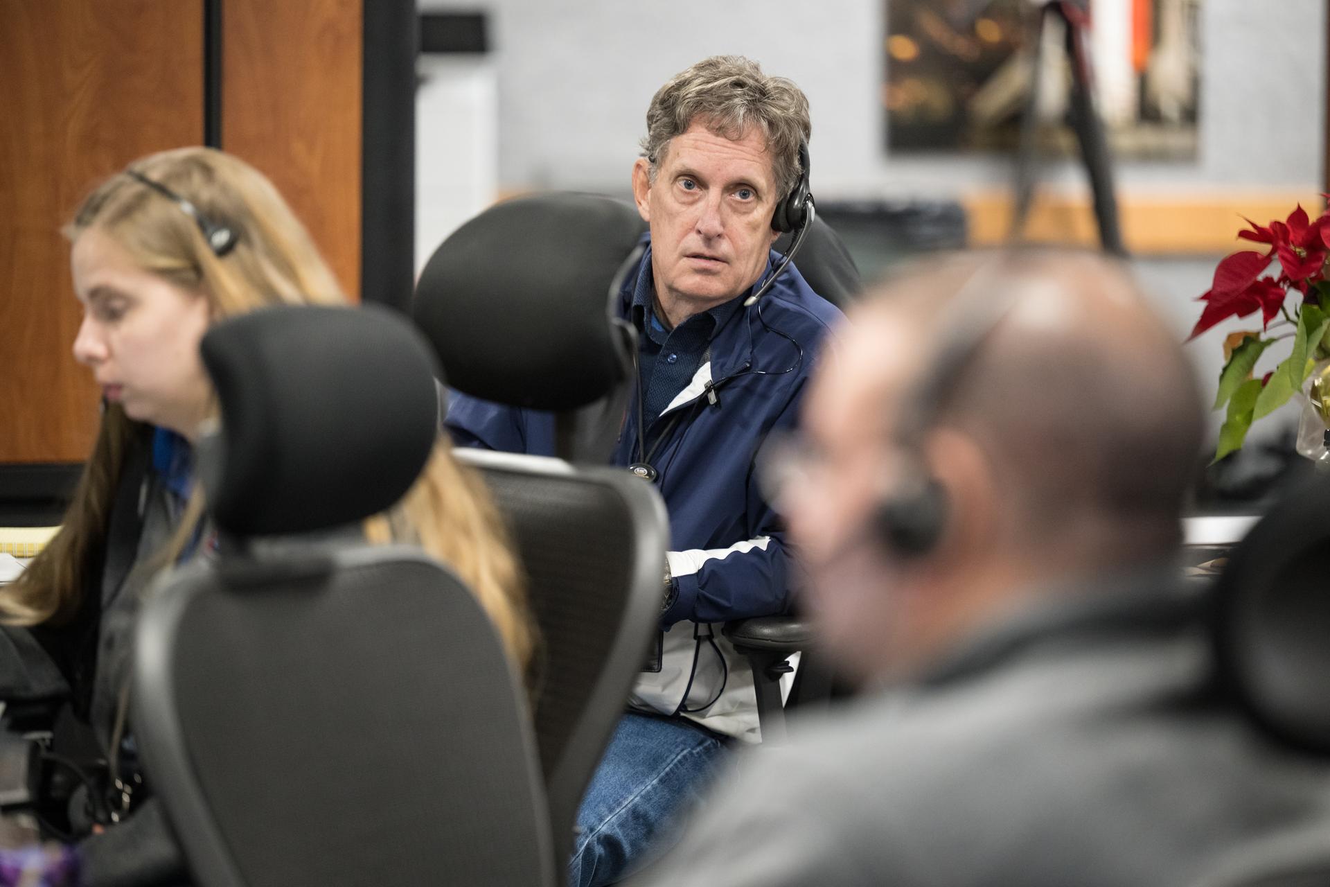 Members of the Artemis II launch team are seen on console in Firing Room One of the Rocco A. Petrone Launch Control Center as NASA’s Artemis II Space Launch System (SLS) rocket and Orion spacecraft, secured to the mobile launcher, roll out of High Bay 3 of the Vehicle Assembly Building to Launch Complex 39B, Saturday, Jan. 17, 2026, at NASA’s Kennedy Space Center in Florida. NASA’s Artemis II test flight will take Commander Reid Wiseman, Pilot Victor Glover, and Mission Specialist Christina Koch from NASA, and Mission Specialist Jeremy Hansen from the CSA (Canadian Space Agency), around the Moon and back to Earth no later than April 2026. Photo Credit: (NASA/Aubrey Gemignani)