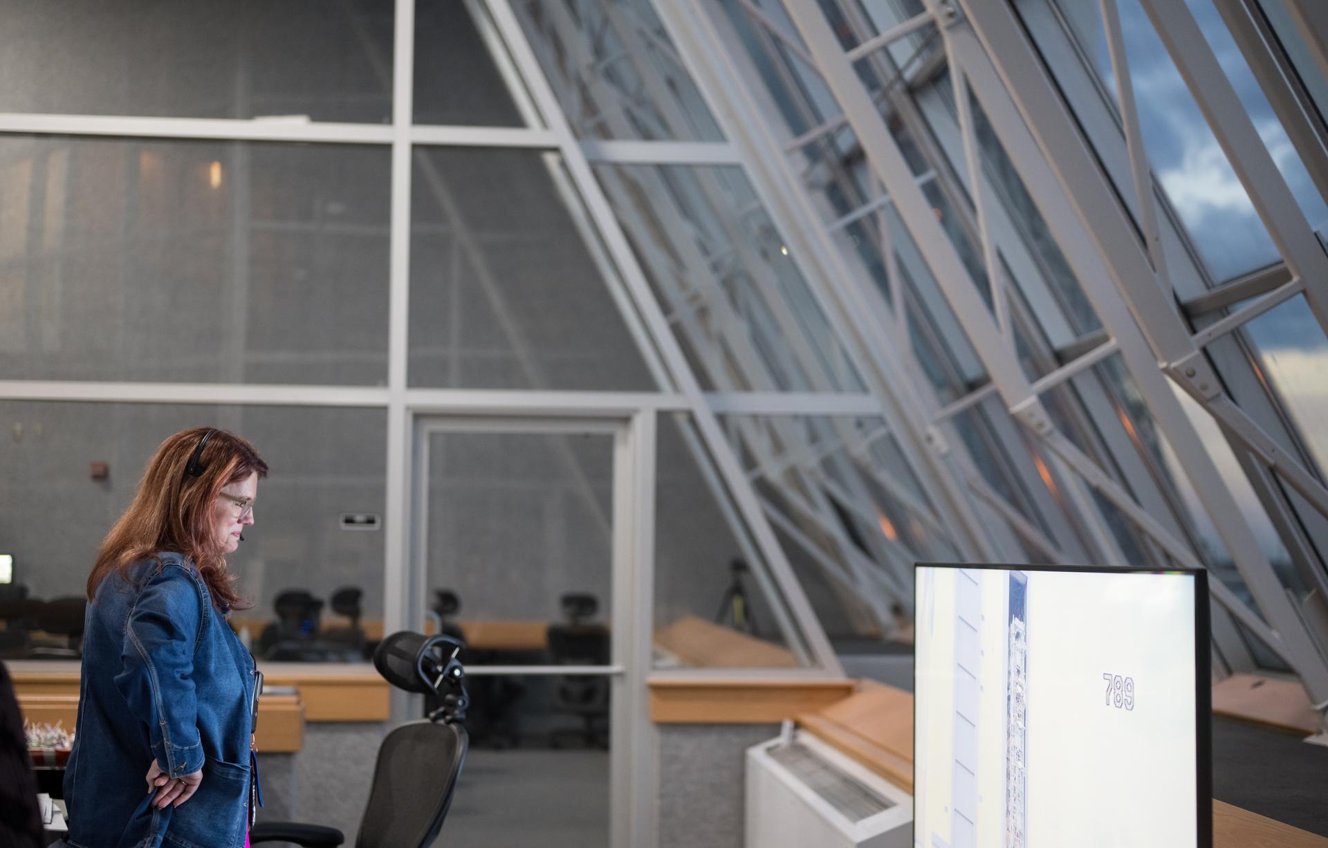 Charlie Blackwell-Thompson, Artemis II launch director at NASA's Kennedy Space Center is seen on console in Firing Room One of the Rocco A. Petrone Launch Control Center as NASA’s Artemis II Space Launch System (SLS) rocket and Orion spacecraft, secured to the mobile launcher, roll out of High Bay 3 of the Vehicle Assembly Building to Launch Complex 39B, Saturday, Jan. 17, 2026, at NASA’s Kennedy Space Center in Florida. NASA’s Artemis II test flight will take Commander Reid Wiseman, Pilot Victor Glover, and Mission Specialist Christina Koch from NASA, and Mission Specialist Jeremy Hansen from the CSA (Canadian Space Agency), around the Moon and back to Earth no later than April 2026. Photo Credit: (NASA/Aubrey Gemignani)