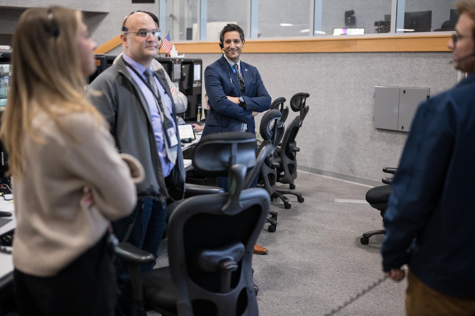 Members of the Artemis II launch team are seen on console in Firing Room One of the Rocco A. Petrone Launch Control Center as NASA’s Artemis II Space Launch System (SLS) rocket and Orion spacecraft, secured to the mobile launcher, roll out of High Bay 3 of the Vehicle Assembly Building to Launch Complex 39B, Saturday, Jan. 17, 2026, at NASA’s Kennedy Space Center in Florida. NASA’s Artemis II test flight will take Commander Reid Wiseman, Pilot Victor Glover, and Mission Specialist Christina Koch from NASA, and Mission Specialist Jeremy Hansen from the CSA (Canadian Space Agency), around the Moon and back to Earth no later than April 2026. Photo Credit: (NASA/Aubrey Gemignani) Portions of this image have been blurred for security reasons.