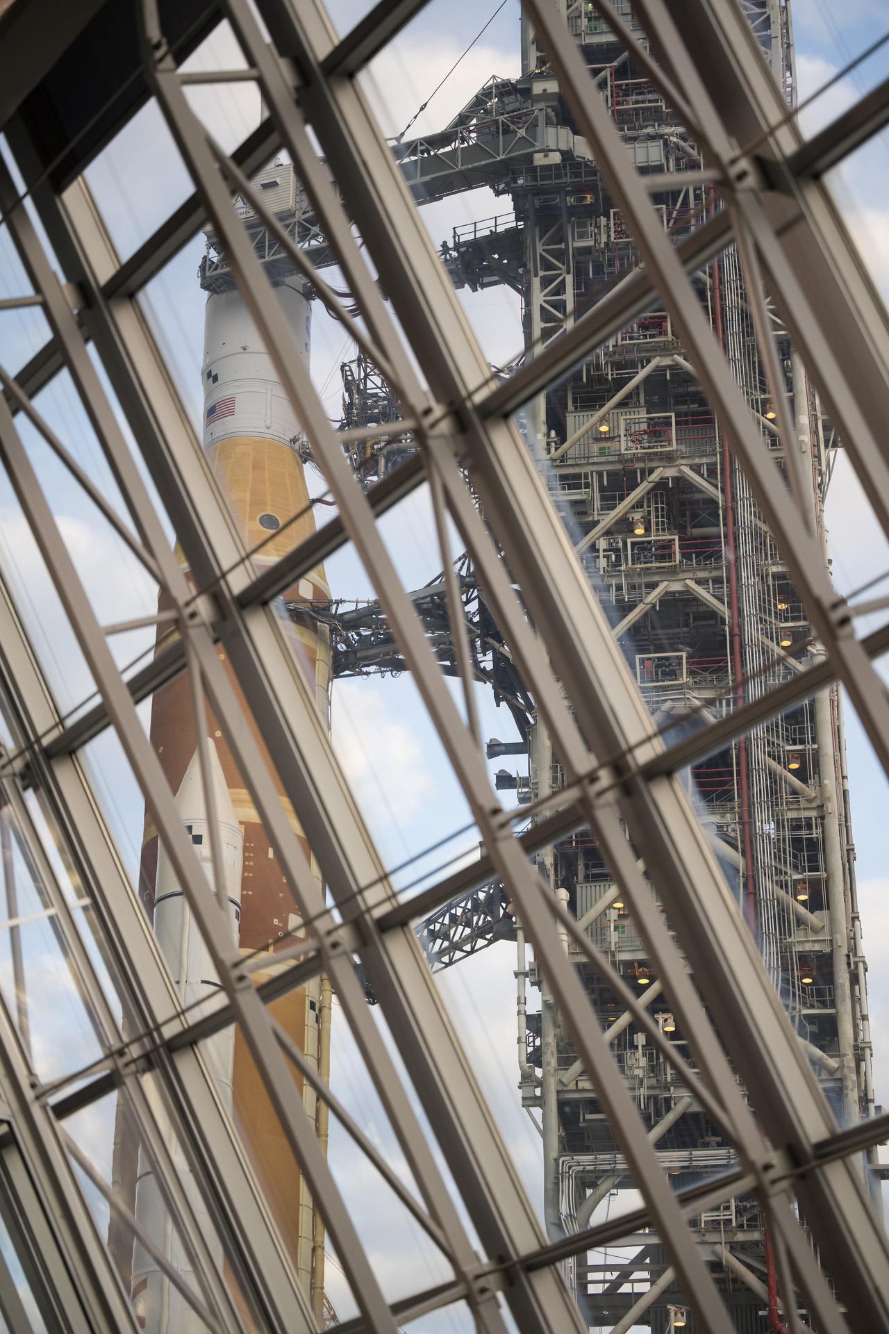 NASA’s Artemis II Space Launch System (SLS) rocket and Orion spacecraft, secured to the mobile launcher is seen from Firing Room One of the Rocco A. Petrone Launch Control Center as it rolls out of High Bay 3 of the Vehicle Assembly Building to Launch Complex 39B, Saturday, Jan. 17, 2026, at NASA’s Kennedy Space Center in Florida. NASA’s Artemis II test flight will take Commander Reid Wiseman, Pilot Victor Glover, and Mission Specialist Christina Koch from NASA, and Mission Specialist Jeremy Hansen from the CSA (Canadian Space Agency), around the Moon and back to Earth no later than April 2026. Photo Credit: (NASA/Aubrey Gemignani)
