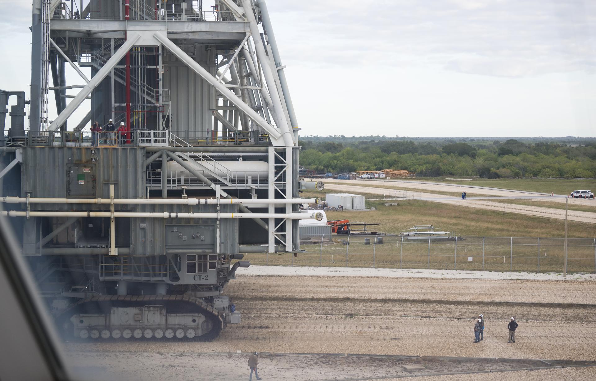 The mobile launcher carrying NASA’s Space Launch System (SLS) rocket and Orion spacecraft, is seen as it rolls out of the Vehicle Assembly Building to Launch Pad 39B, Saturday, Jan. 17, 2026, at NASA’s Kennedy Space Center in Florida. NASA’s Artemis II test flight will take Commander Reid Wiseman, Pilot Victor Glover, and Mission Specialist Christina Koch from NASA, and Mission Specialist Jeremy Hansen from the CSA (Canadian Space Agency), around the Moon and back to Earth no later than no later than April 2026. Photo Credit: (NASA/Aubrey Gemignani)