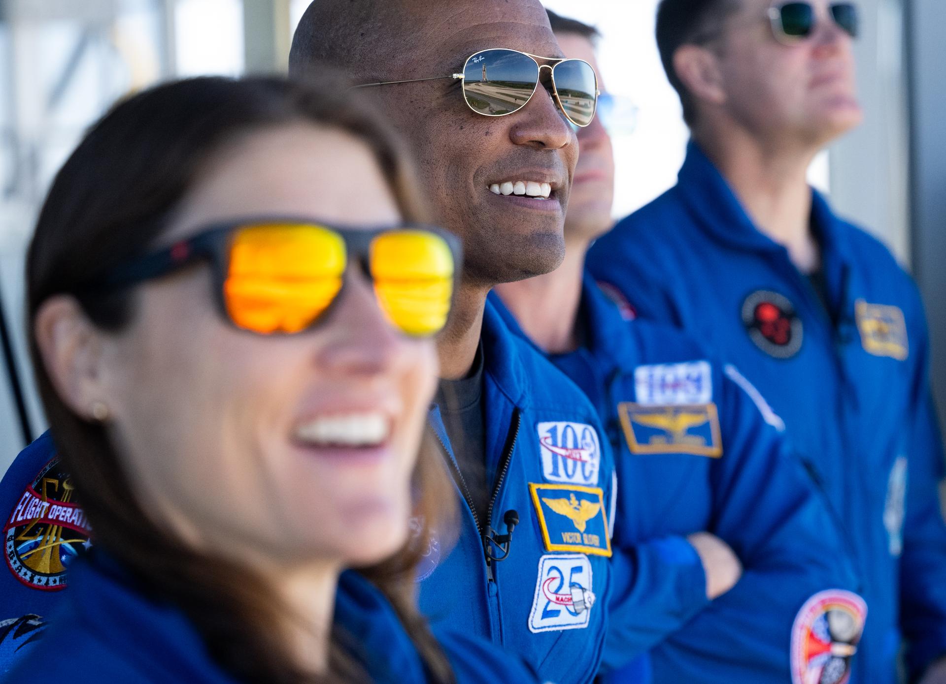 NASA’s Space Launch System (SLS) rocket and Orion spacecraft, secured to the mobile launcher, are reflected in the sunglasses of NASA astronaut Victor Glover, Artemis II pilot, as he and fellow crewmates NASA astronauts Christina Koch, Artemis II mission specialist, Reid Wiseman, Artemis II commander, and CSA (Canadian Space Agency) astronaut Jeremy Hansen watch them make the 4.2 mile journey to Launch Pad 39B atop crawler-transporter 2, Saturday, Jan. 17, 2026, at NASA’s Kennedy Space Center in Florida. NASA’s Artemis II test flight will take Hansen, Wiseman, Glover, and Koch around the Moon and back to Earth no later than April 2026. Photo Credit: (NASA/Joel Kowsky)
