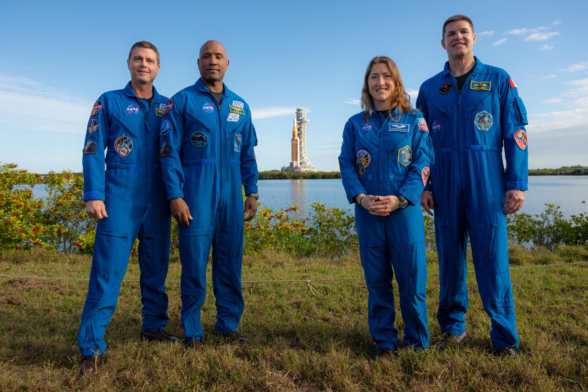 NASA astronauts Reid Wiseman, Artemis II commander; Victor Glover, Artemis II pilot; Christina Koch, Artemis II mission specialist; and CSA (Canadian Space Agency) astronaut Jeremy Hansen, Artemis II mission specialist, pose for a photograph as NASA’s Artemis II SLS (Space Launch System) rocket and Orion spacecraft roll out to Launch Complex 39B, Saturday, Jan. 17, 2026, at NASA’s Kennedy Space Center in Florida. Photo Credit: (NASA/John Kraus)