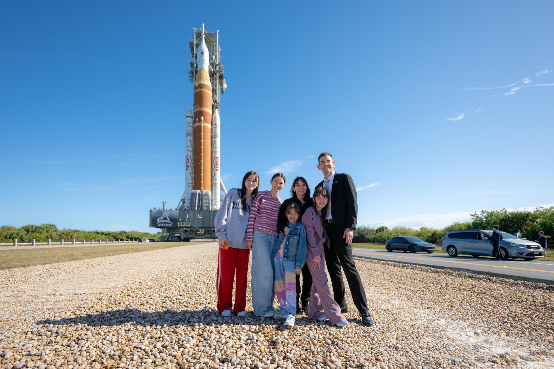 NASA Administrator Jared Isaacman, right, poses with members of his family as NASA’s Artemis II SLS (Space Launch System) rocket and Orion spacecraft roll out to Launch Complex 39B, Saturday, Jan. 17, 2026, at NASA’s Kennedy Space Center in Florida. Photo Credit: (NASA/John Kraus)